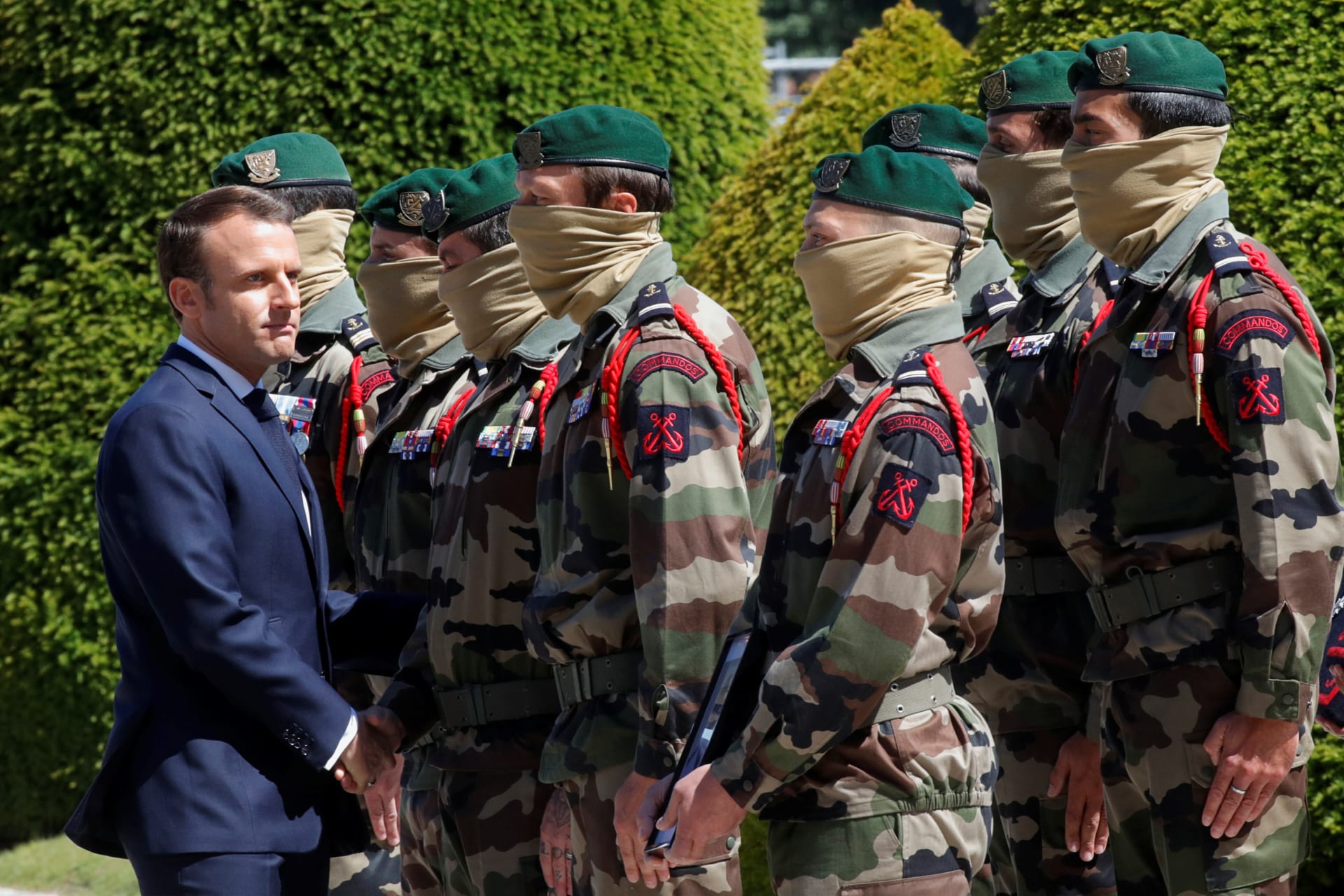 <p>French President Emmanuel Macron shakes hands with the special forces soldiers during a national tribute for two soldiers who were killed in a night-time rescue in Burkina Faso of four foreign hostages in Paris, France, on May 14, 2019. </p>
