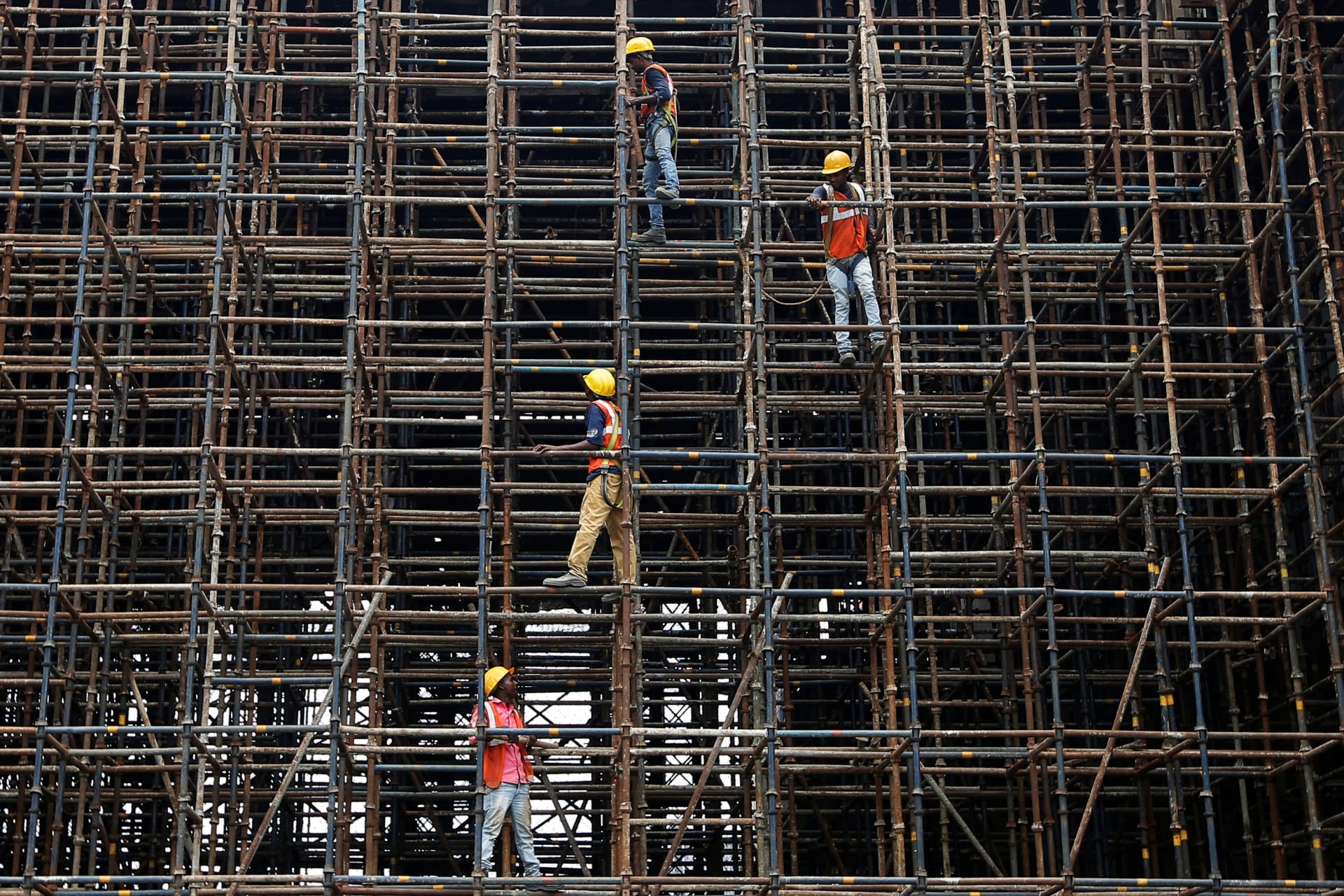 <p>Laborers work at the construction site of a metro rail station in Kolkata, India, July 2, 2018.</p>
