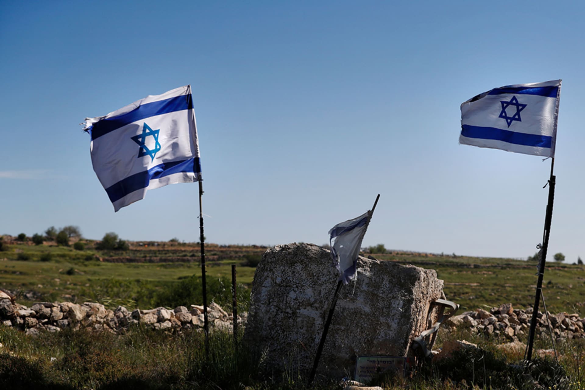 <p>Israeli flags in front of a partial view of the Israeli settlement of Efrat situated on the southern outskirts of the West Bank city of Bethlehem.</p>
