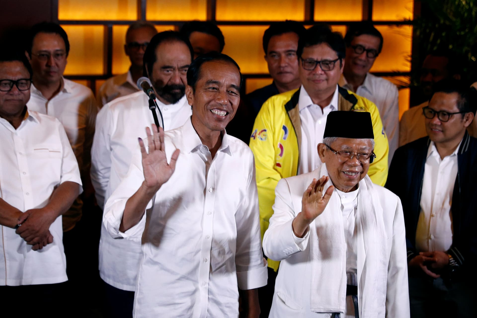 <p>Indonesia’s President Joko Widodo and his running mate Ma’ruf Amin react after a quick count result during the Indonesian elections in Jakarta, Indonesia on April 17, 2019.</p>

