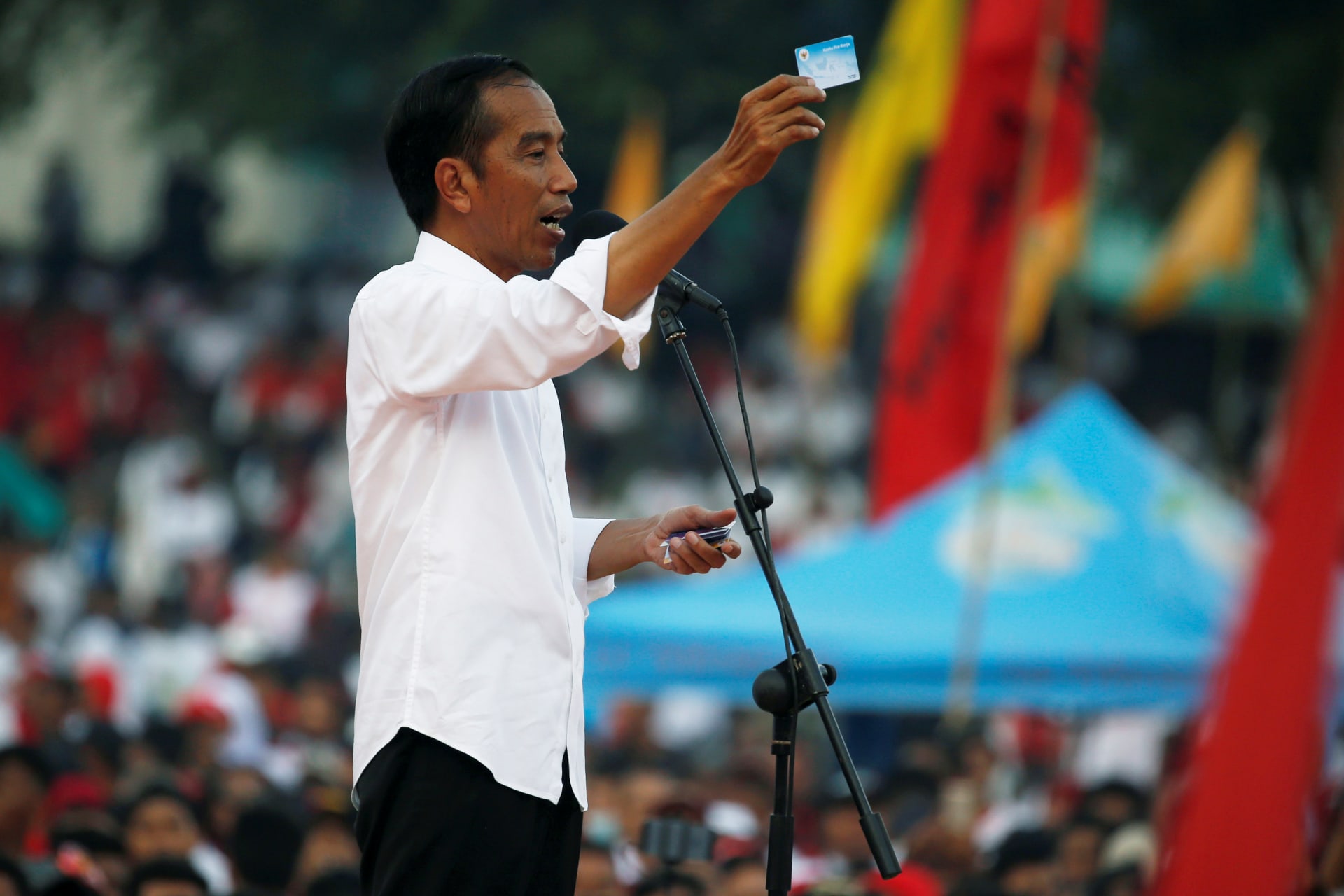 <p>Indonesia’s president and presidential candidate for the next election Joko Widodo gestures as he gives a speech during a campaign rally in Solo, Indonesia, on April 9, 2019.</p>
