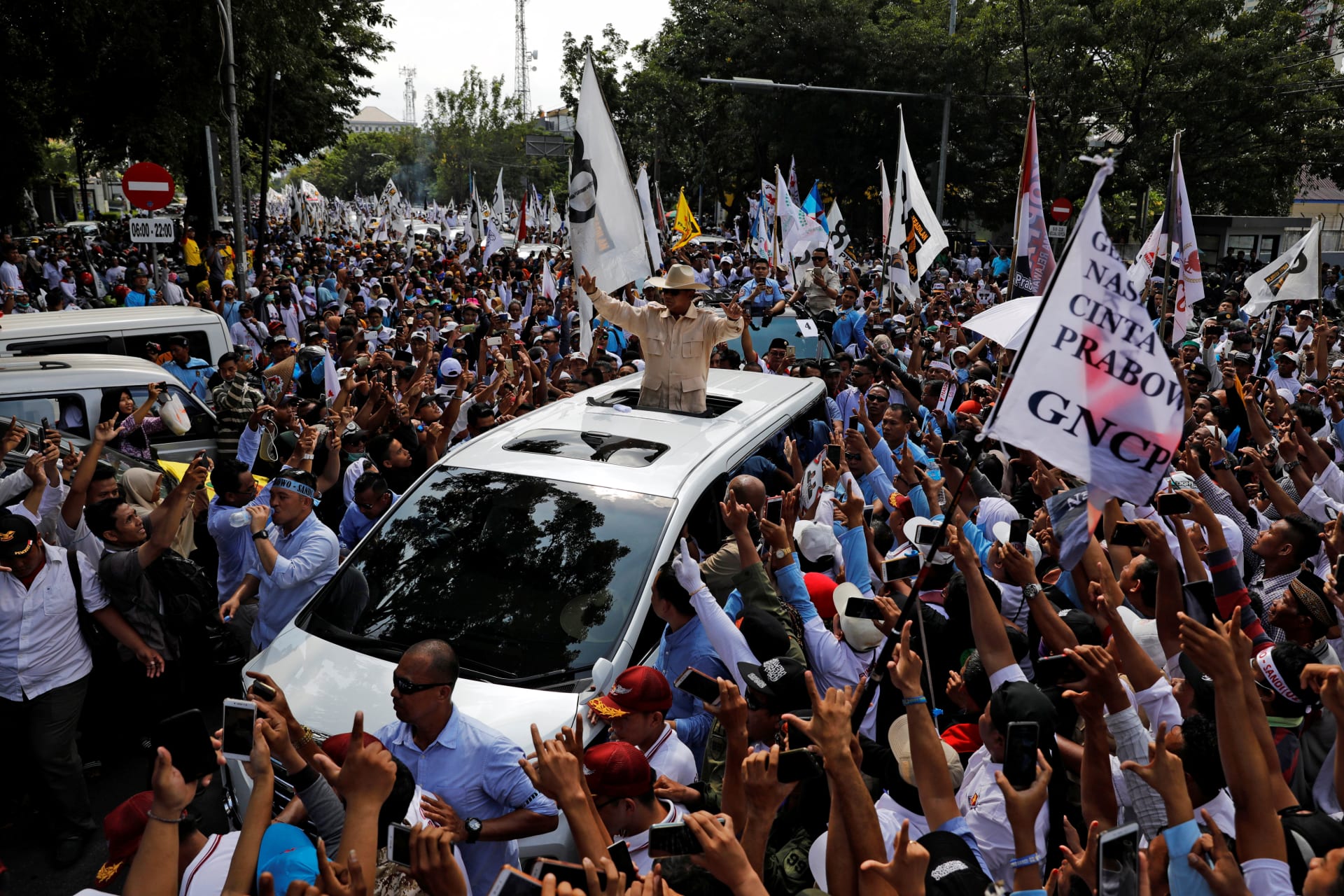 <p>Indonesia’s presidential candidate Prabowo Subianto, who was a former general of the Indonesian military, gestures as he greets supporters from a car during a campaign rally in Solo, Central Java Province, Indonesia, on April 10, 2019.</p>
