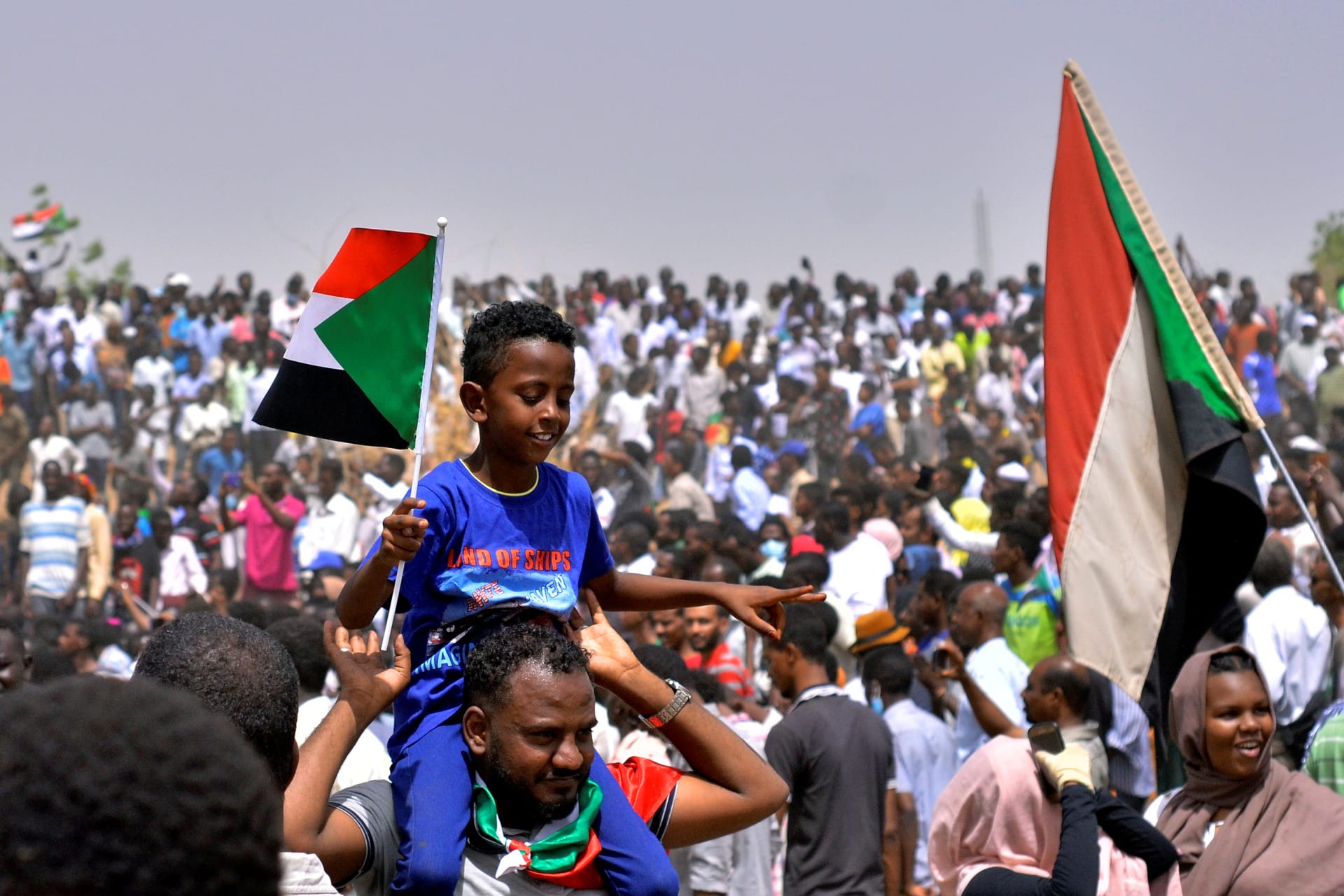 <p> Sudanese demonstrators celebrate after the announcement that President Omar al-Bashir had been detained and a military council would run the country for a two-year transitional period, Khartoum, Sudan April 11, 2019.</p>
