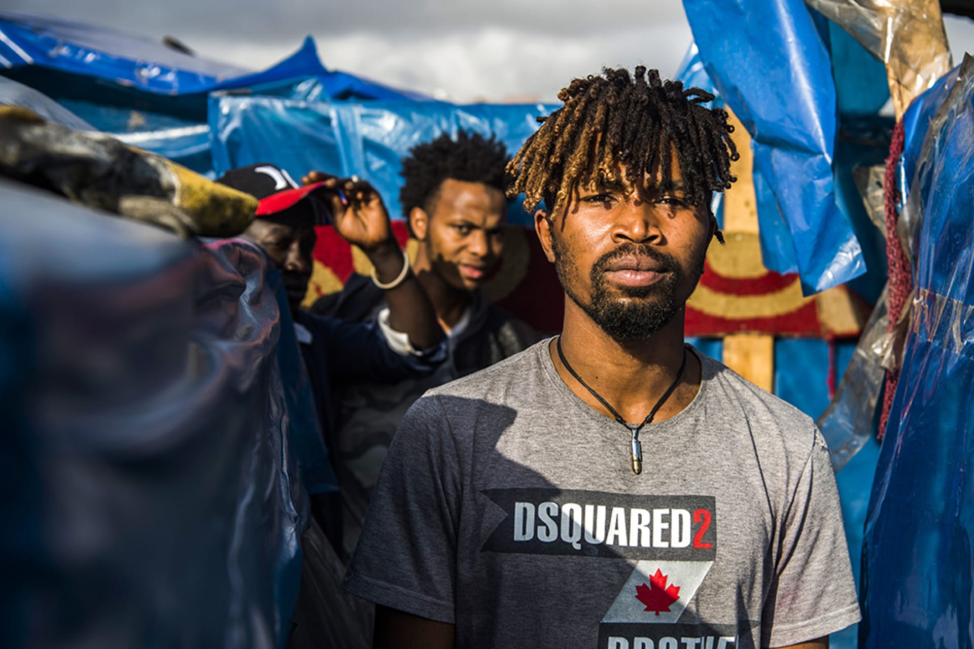<p>A sub-Saharan migrant walks between make-shift tents in the Oulad Ziane migrant camp in Casablanca on March 27, 2019.</p>