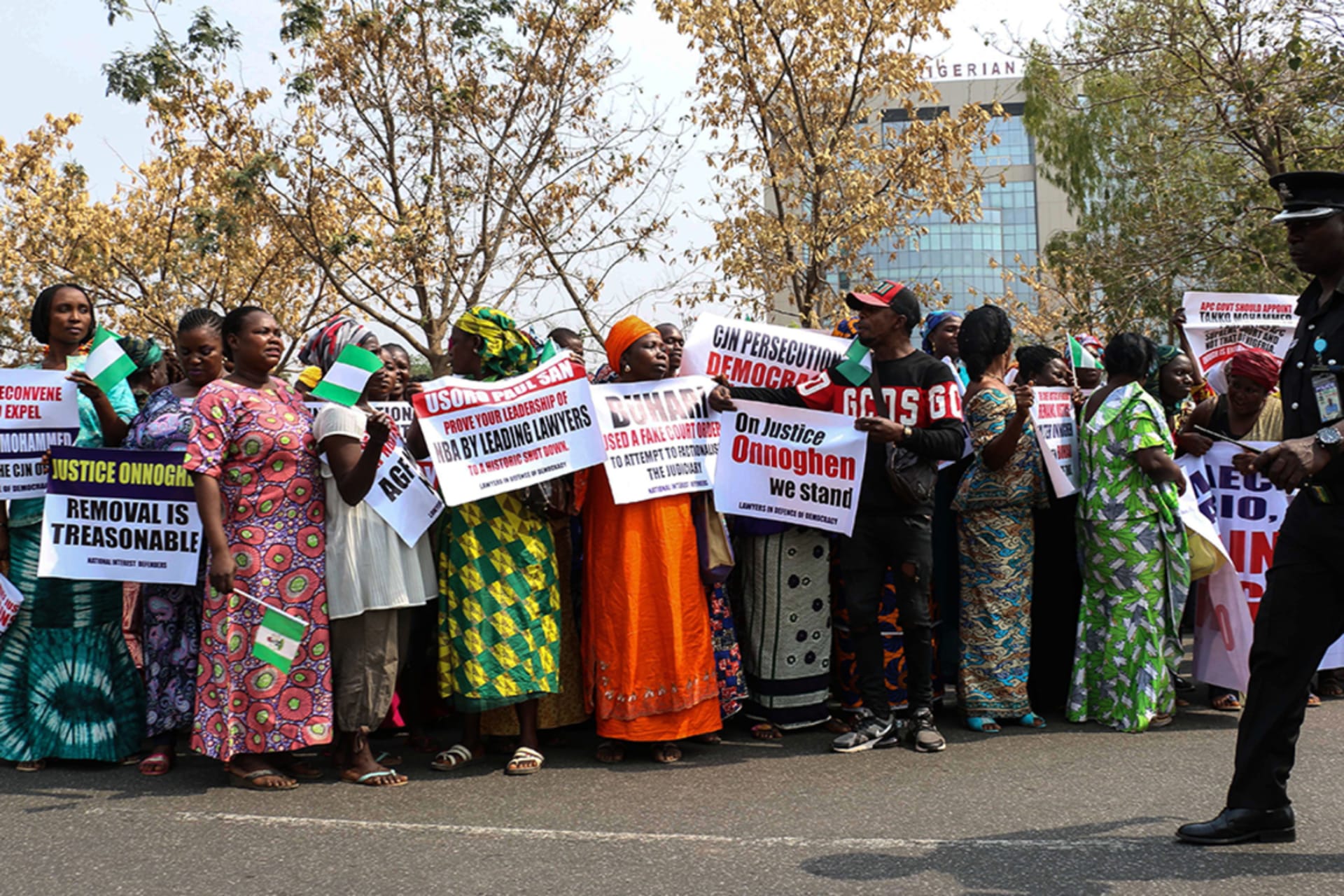 <p>Protesters holding signs assemble outside the secretariat of the Nigerian Bar Association during a protest in Abuja over the suspension of Chief Justice of Nigeria (CJN) in Abuja on January 28, 2019.</p>
