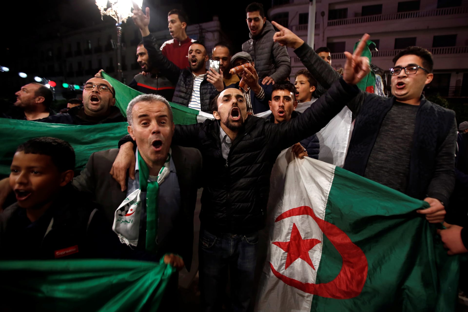 <p>People celebrate on the streets after Algeria’s President Abdelaziz Bouteflika has submitted his resignation, in Algiers, Algeria April 2, 2019.</p>
