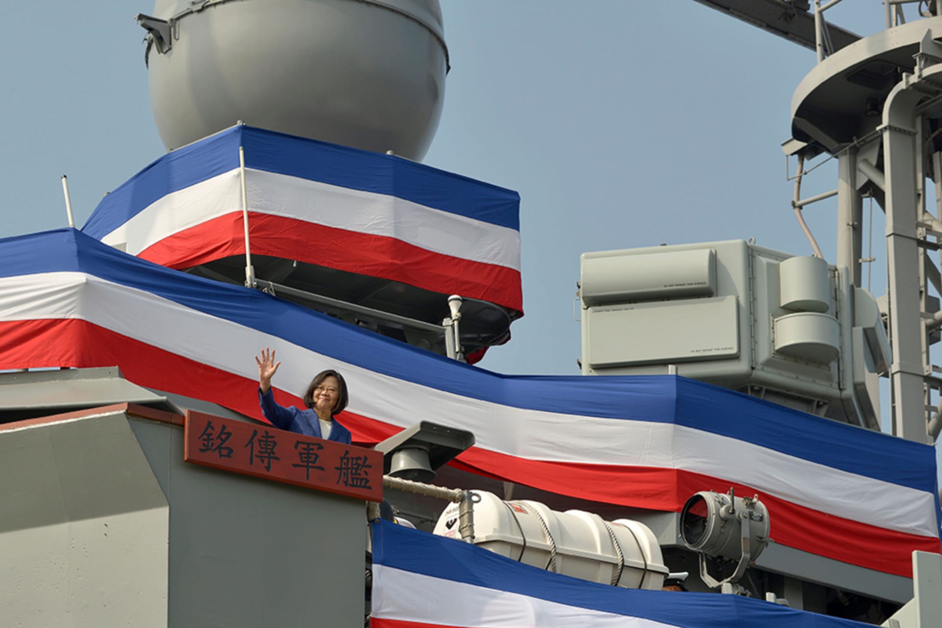 <p>Taiwanese President Tsai Ing-wen waves on the deck of a warship purchased from the United States.</p>
