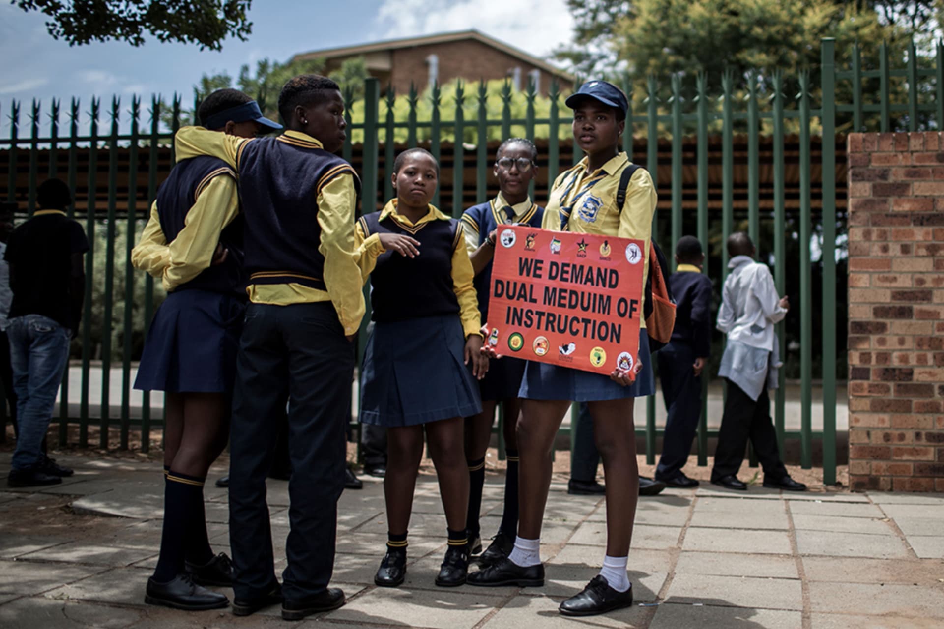 <p>Students from surrounding schools and other stakeholders hold a cardboard as they march against the language and admission policies at Ho?erskool Overvaal school on January 25, 2018, in Vereeniging, South Africa.</p>
