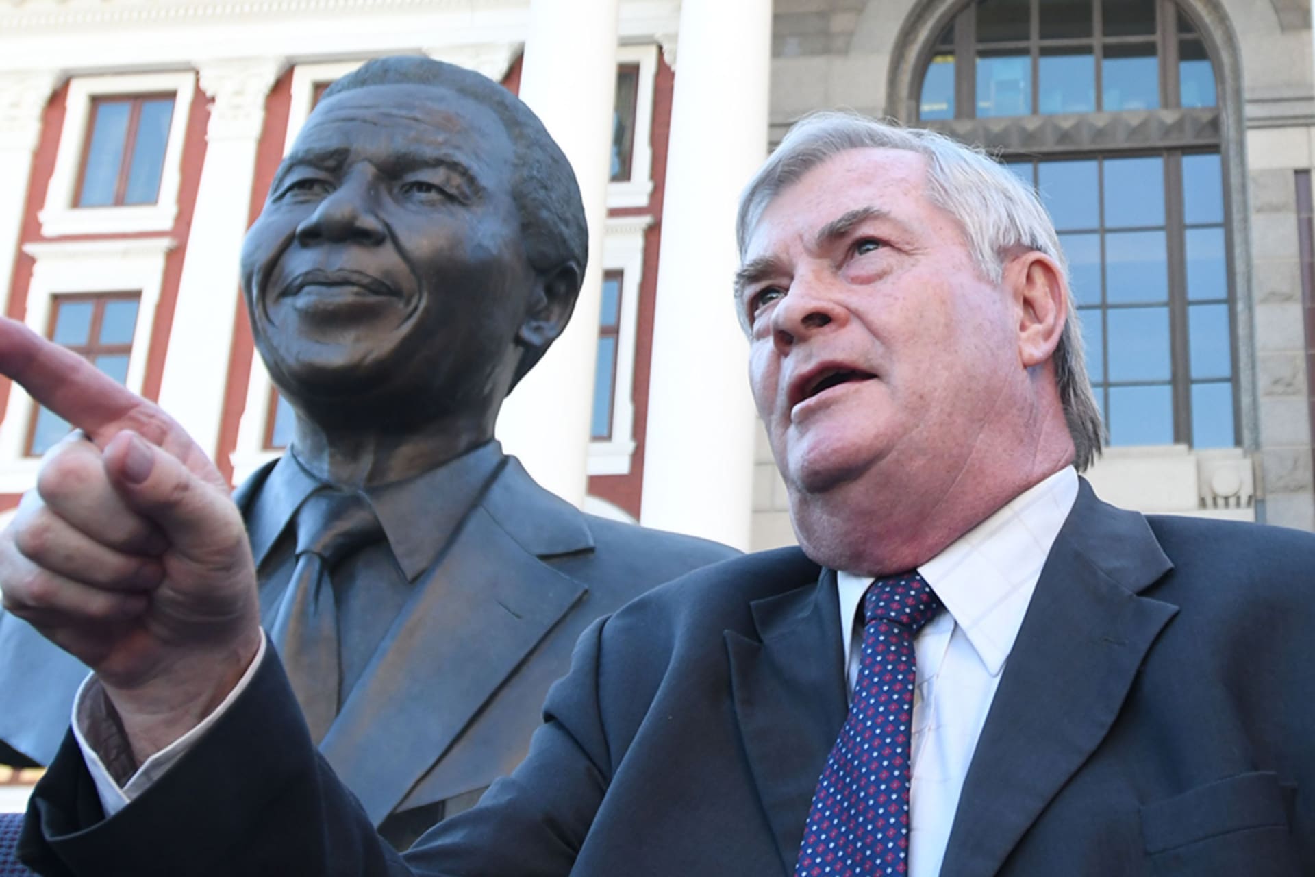 <p>Pieter Groenewalk, leader of Freedom Front Plus, addresses the crowd after Baleka Mbete, the speaker of parliament, announced her decision on the vote of no confidence in President Jacob Zuma in Cape Town, South Africa, on August 07, 2017.</p>
