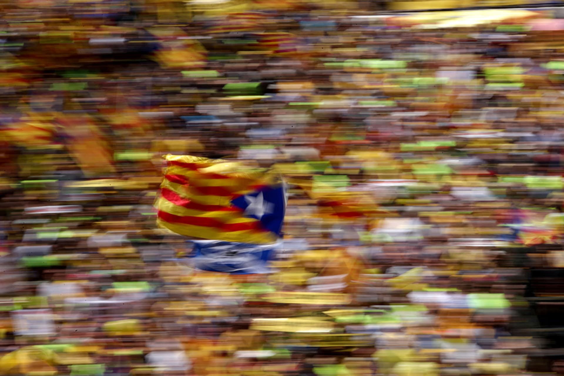 <p>A pro-independence supporter waves a Catalan separatist flag during a demonstration in Barcelona, Spain.</p>
