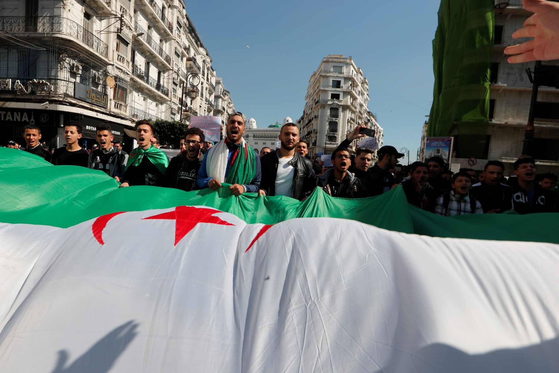 <p>People take part in a protest demanding immediate political change in Algiers, Algeria March 12, 2019</p>
