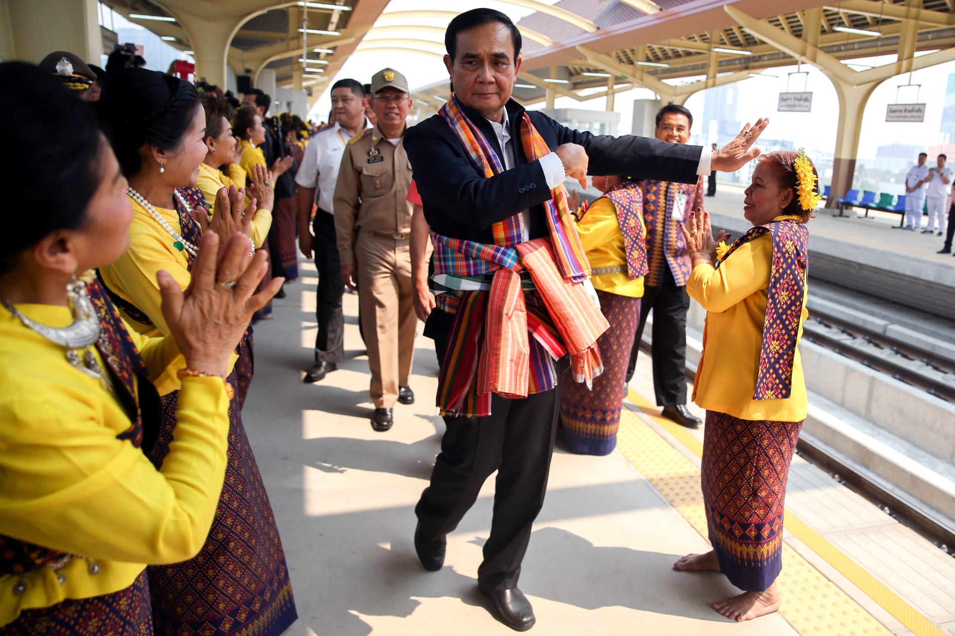 <p>Thailand’s Prime Minister Prayuth Chan-ocha performs a traditional dance with performers at Khon Kaen railway station during a visit ahead of the general election in Khon Kaen Province, Thailand, on March 13, 2019. </p>
