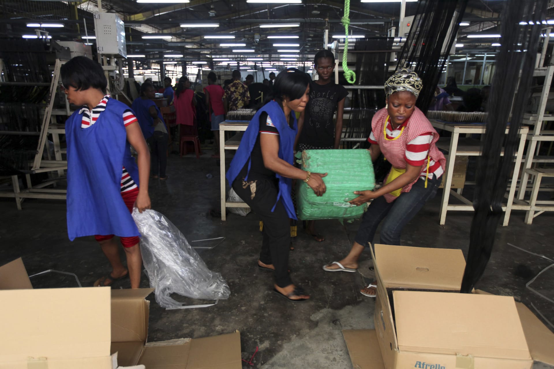 <p>Women work in Amingos fiber hair factory in Ikeja district in Lagos, on December 1, 2011.</p>
