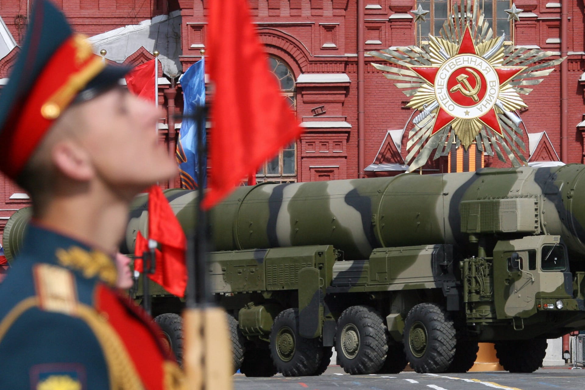 <p>A vehicle carrying a Russian Topol-M ICBM drives across Red Square in a Victory Day Parade in Moscow on May 9, 2008.</p>
