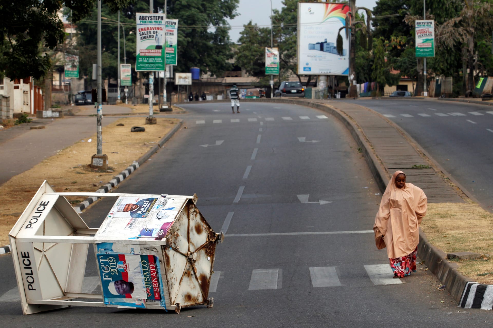 <p>A road leading to a collation centre is blocked, as Nigerians await the result of the Presidential election, in Abuja, Nigeria, on February 24, 2019.</p>
