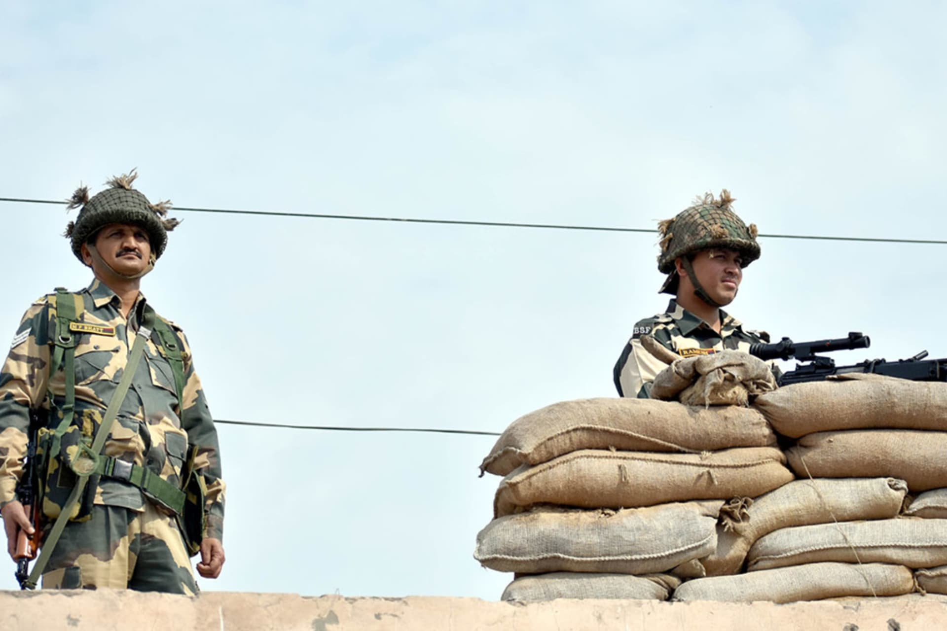 <p>Security personnel stand guard near the Attari-Wagah border crossing.</p>
