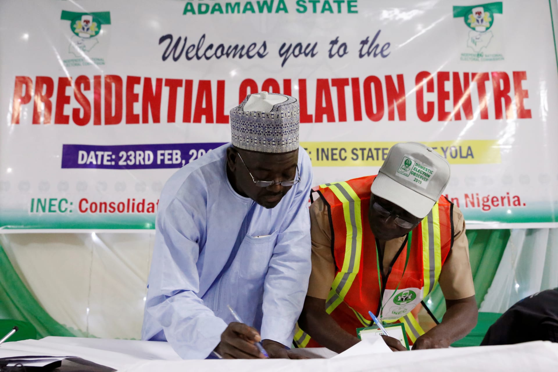 <p>INEC state collation officers go over the declared figures before announcing the results of the presidential election at the State Office in Yola, in Adamawa State, Nigeria, on February 25, 2019.</p>
