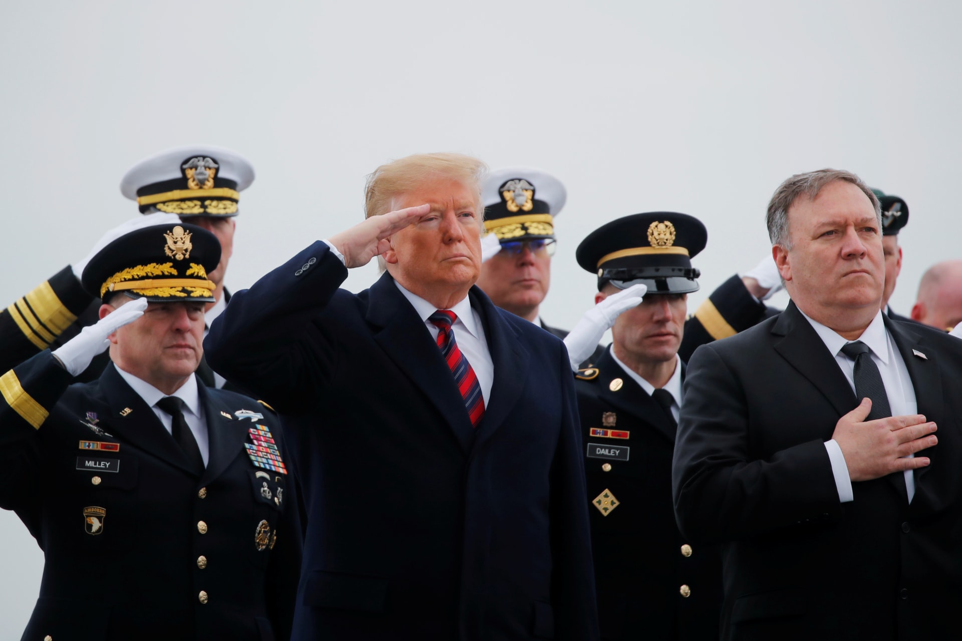 <p>Chief of Staff of the U.S. Army Mark Milley, President Donald Trump, Sgt. Maj. of the Army Daniel Dailey and Secretary of State Mike Pompeo salute as a military honor guard carries the casket of Scott Wirtz</p>

