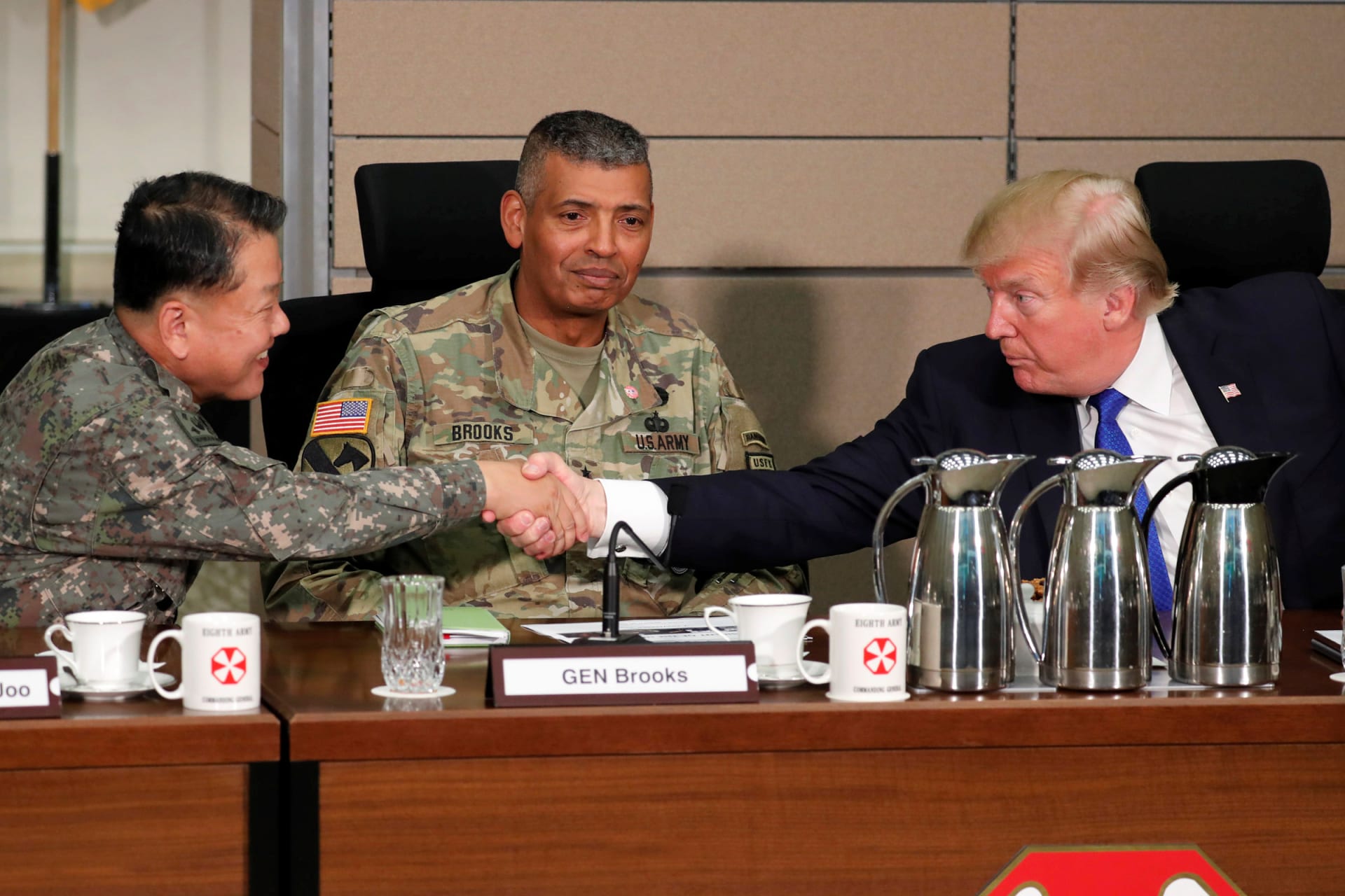 <p>President Trump greets a South Korean general before a briefing from military commanders at Camp Humphreys in 2017.</p>
