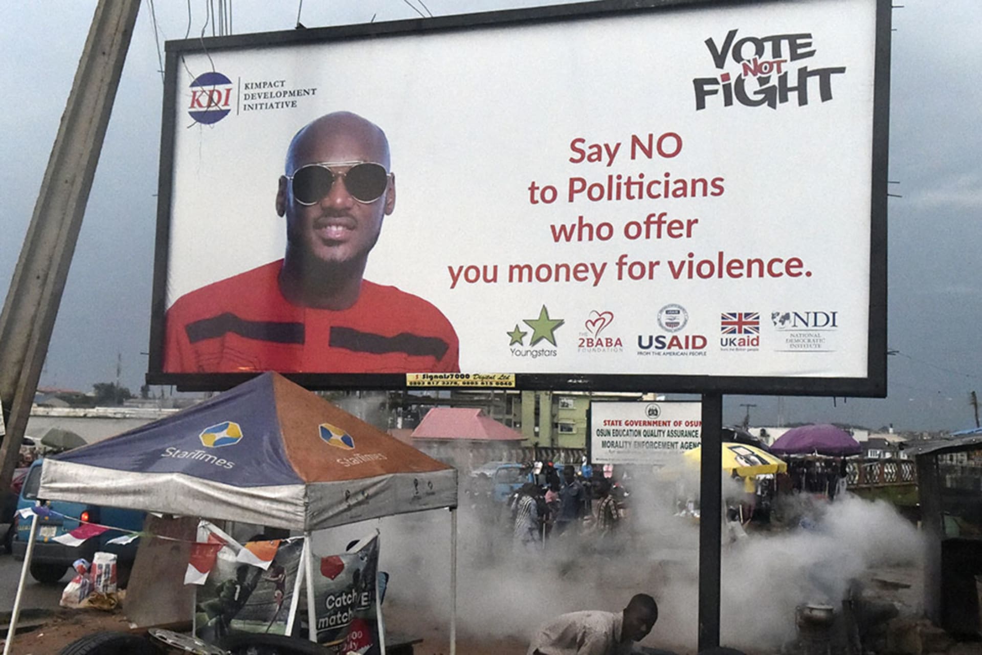 <p>A billboard displays the songwriter Innocent Ujah Idibia popularly known as ‘2Face’ as part of a campaign against politicians who allegedly offer money to youths to foment trouble during elections, in Oshogbo, Osun State, Nigeria on September 21, 2018.</p>
