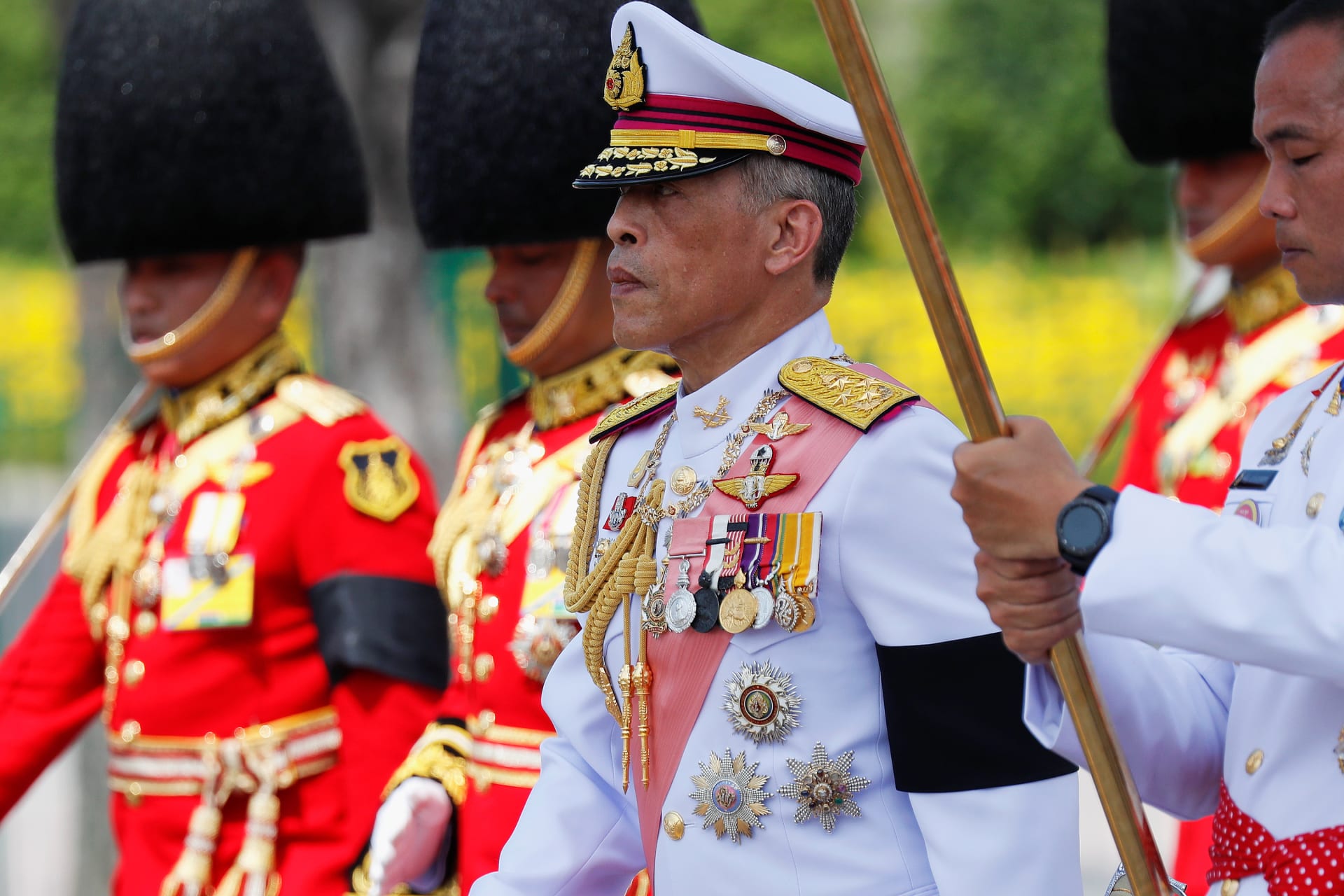 <p>Thailand’s King Maha Vajiralongkorn marches during a procession to transfer the royal relics and ashes of late King Bhumibol Adulyadej from the crematorium to the Grand Palace in Bangkok, Thailand, on October 27, 2017.</p>
