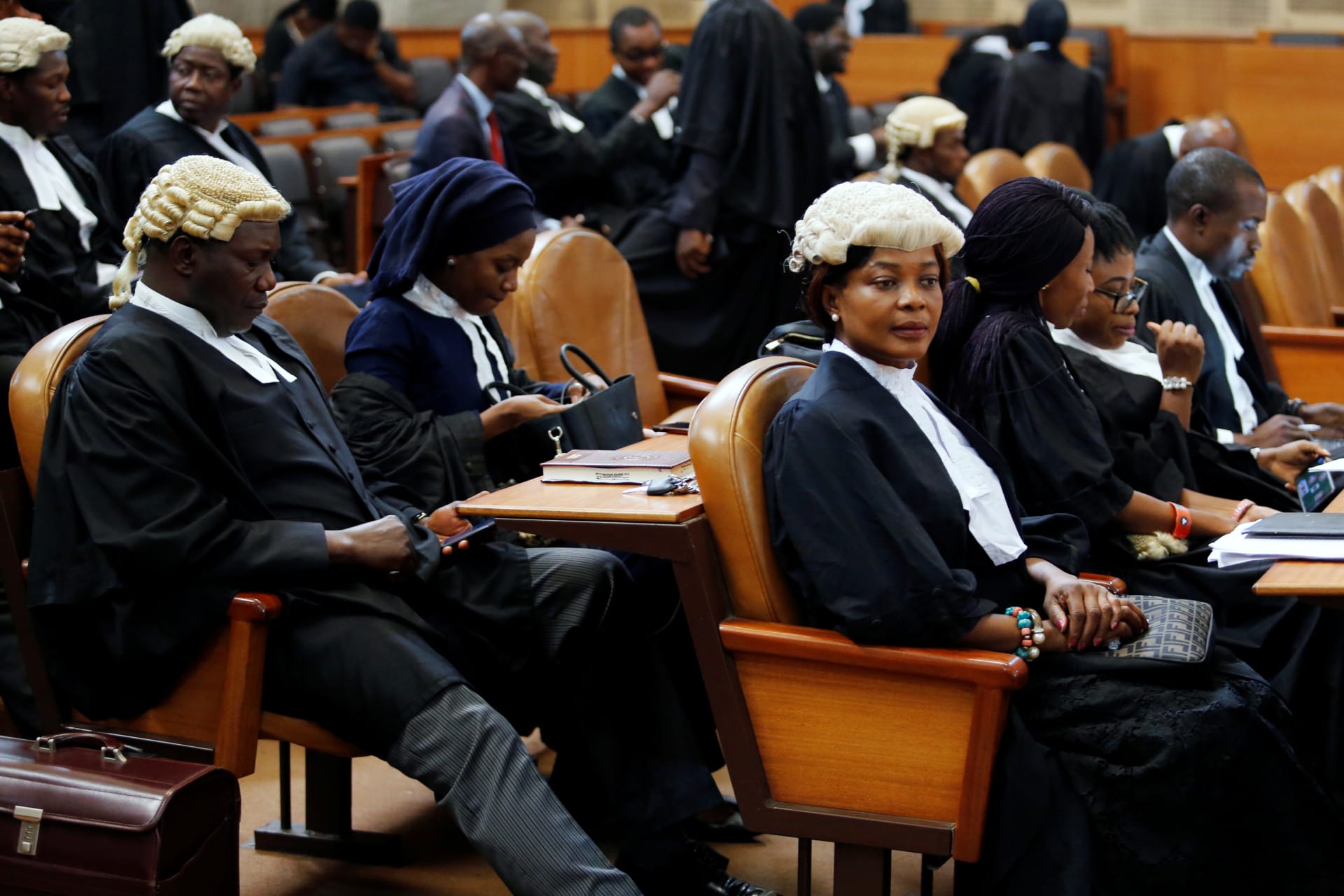 <p>Lawyers are pictured ahead of a hearing to consider whether a tribunal has the authority to try the country’s top judge, Walter Onnoghen, on charges of failing to disclose his assets, in Abuja, Nigeria, on January 30, 2019. </p>
