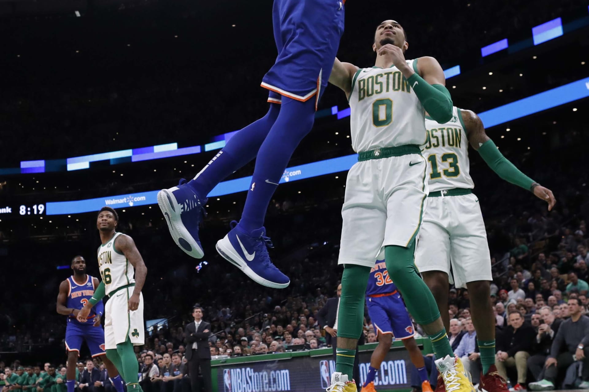 <p>New York Knicks center Enes Kanter (00) dunks the ball over Boston Celtics forward Jayson Tatum (0) during the first half at TD Garden</p>

