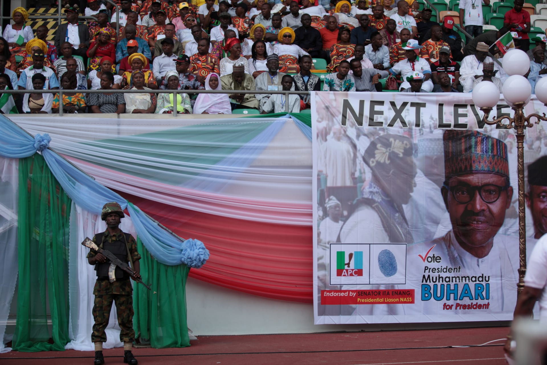 <p>A soldier stands guard during a launch campaign by the ruling All Progressives Congress (APC) party for President Muhammadu Buhari’s reelection bid, in Uyo, Nigeria, on December 28, 2018.</p>
