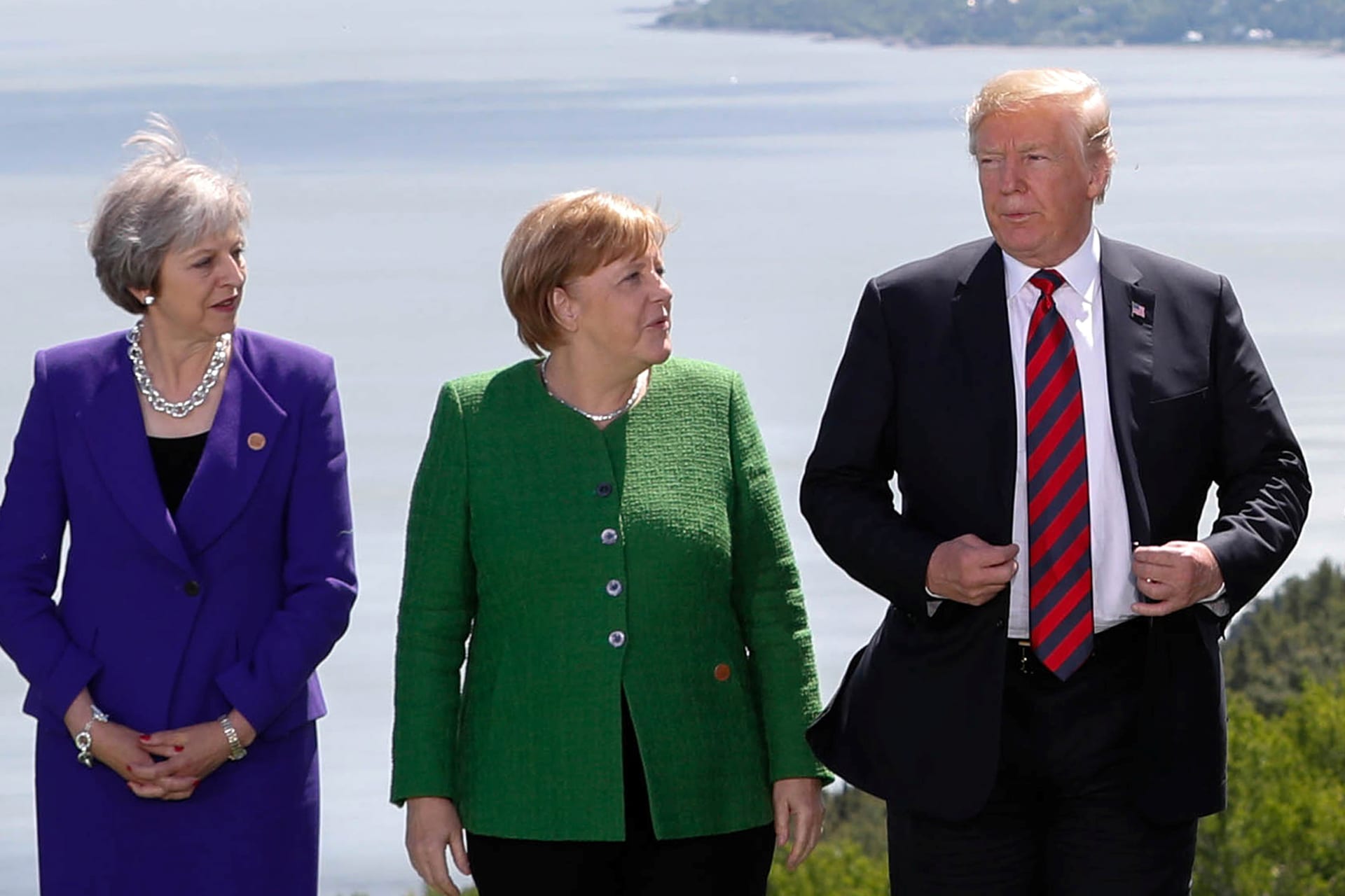 <p>British Prime Minister Theresa May, German Chancellor Angela Merkel, and U.S. President Donald J. Trump pose during a family photo at the G7 Summit in the Charlevoix city of La Malbaie, Quebec, Canada, June 8, 2018.</p>
