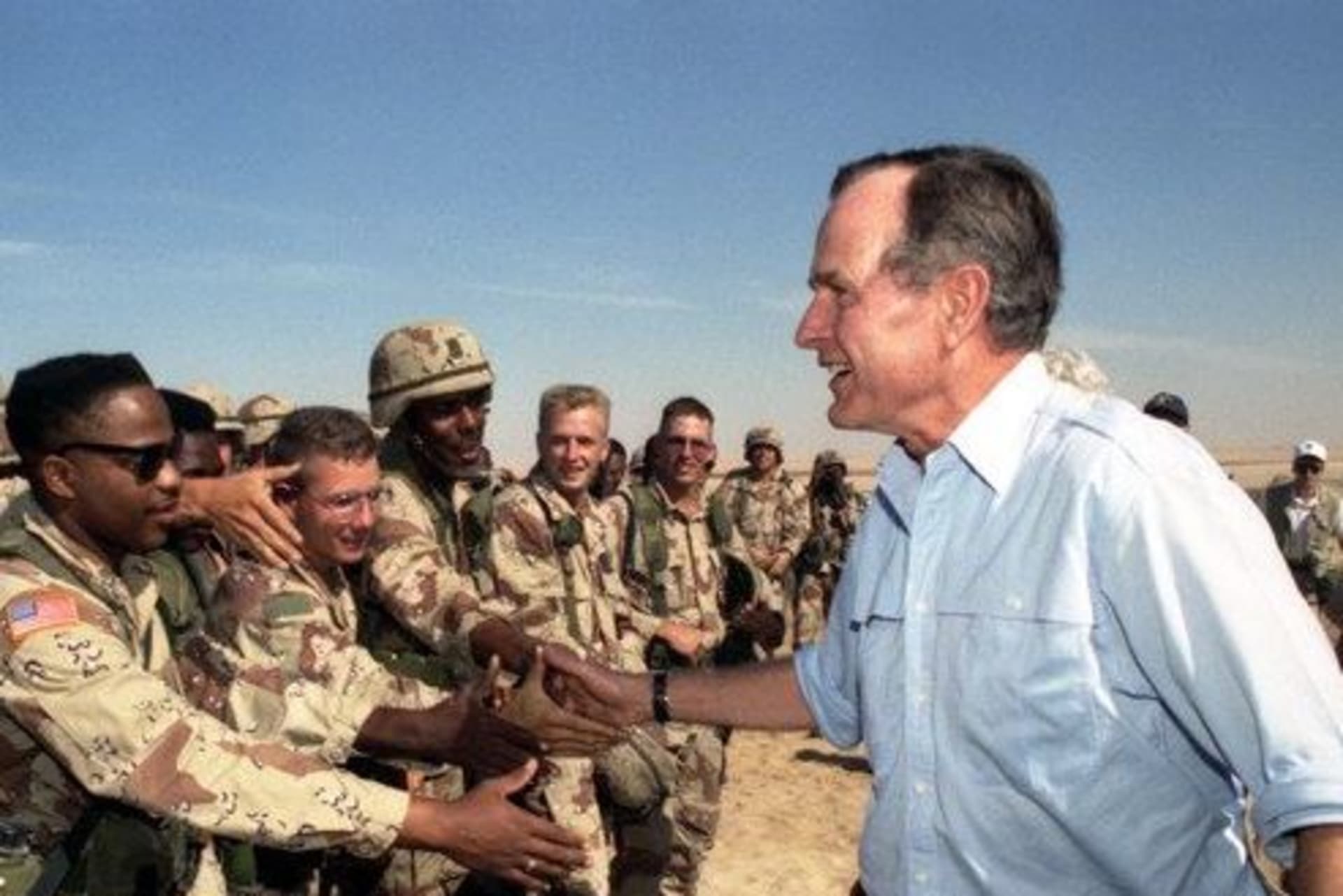 <p>President George H.W. Bush greets troops in Saudi Arabia during a 1990 Thanksgiving visit. </p>
