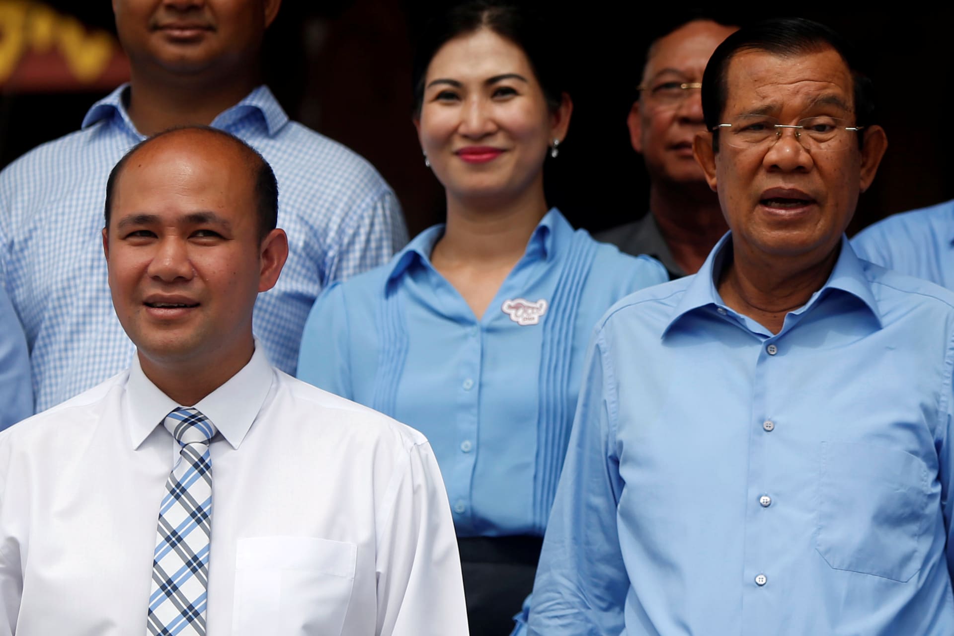 <p>Cambodia’s Prime Minister Hun Sen (R) and his son Hun Many (L), attend a campaign to break the world record for longest cotton scarf weaved, by reaching a length of 1000 meters, in Phnom Penh, Cambodia, June 7, 2018. </p>
