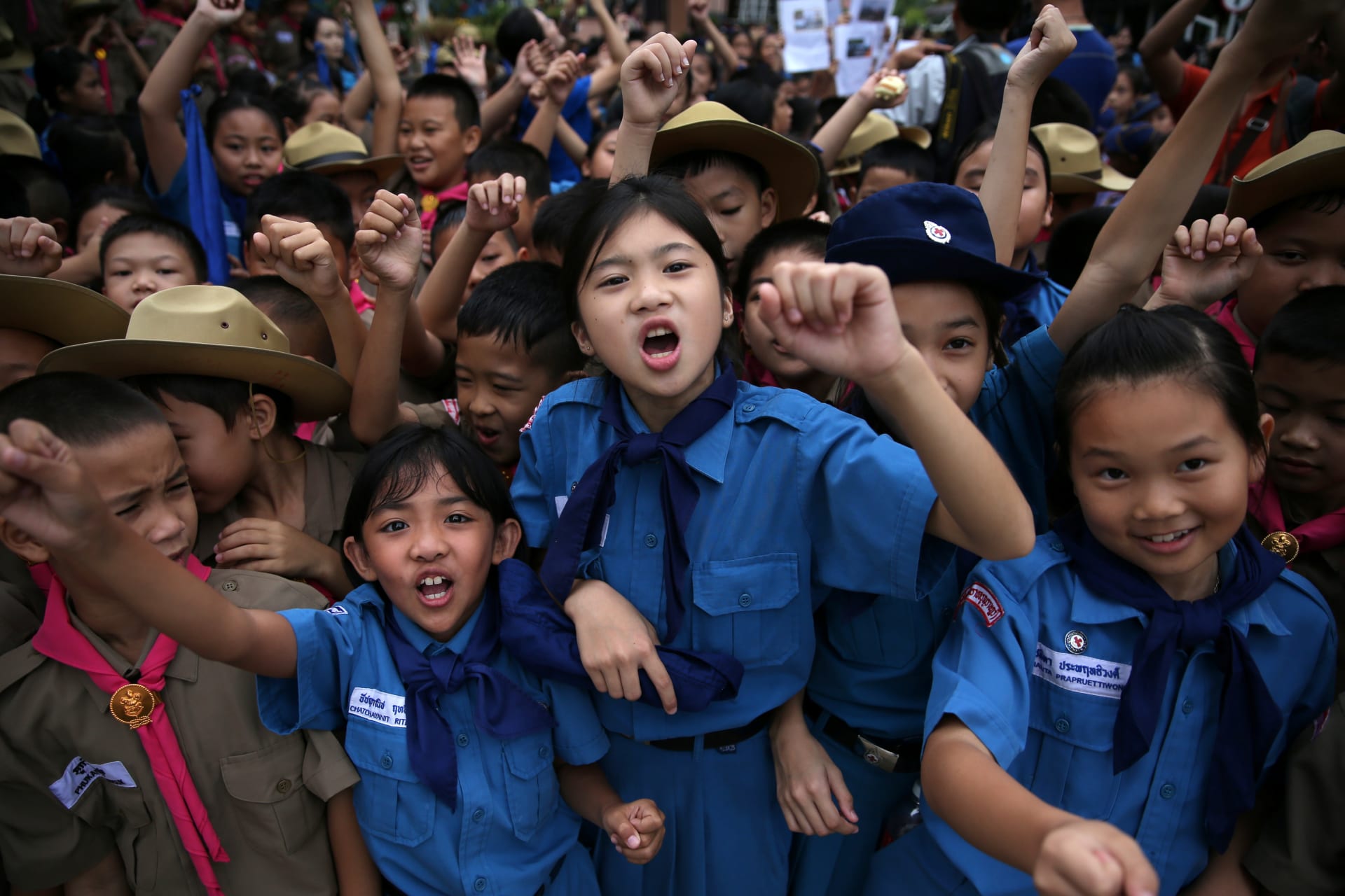 <p>Students celebrate in front of Chiang Rai Prachanukroh Hospital after twelve soccer players and their coach were rescued from Tham Luang Cave in Thailand.</p>
