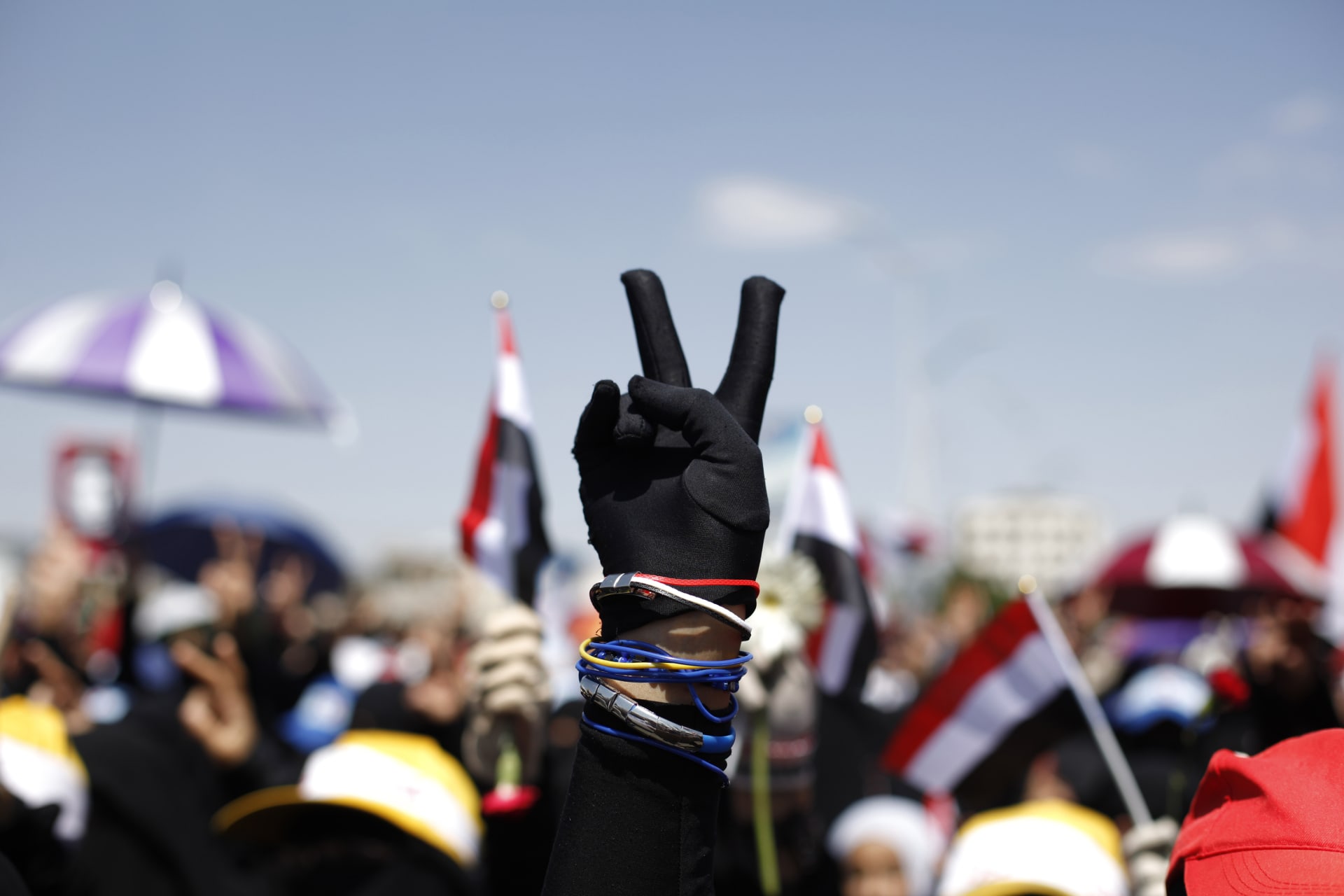 <p>A woman flashes the victory sign during a demonstration to demand the ouster of Yemen’s Former President Ali Abdullah Saleh. Sanaa, October 17, 2011.</p>
