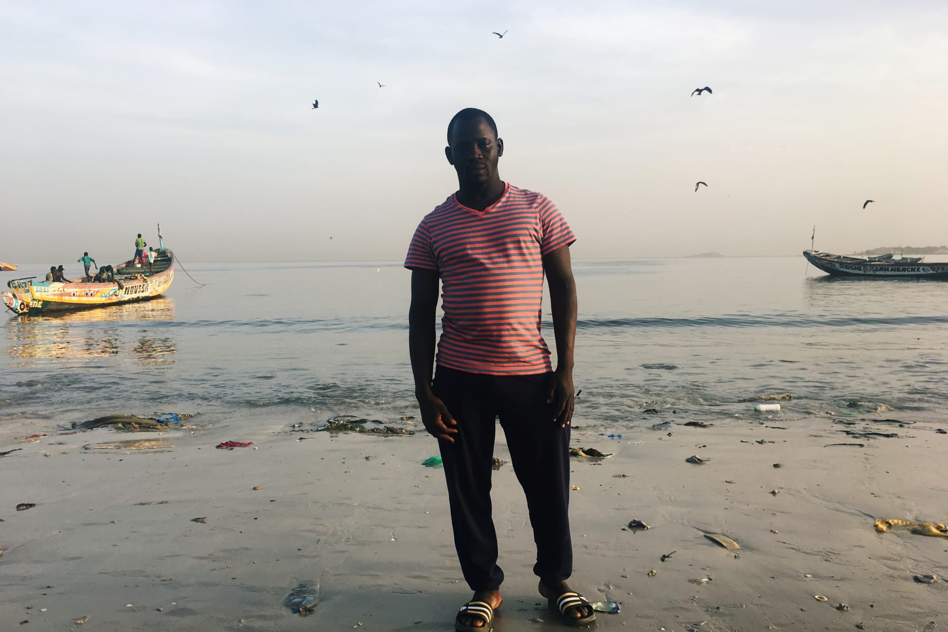 <p>Assane Diallo, a migrant who is preparing to travel by boat from Senegal to the Canary Islands, poses for photograph in Dakar, Senegal, on November 28, 2018.</p>
