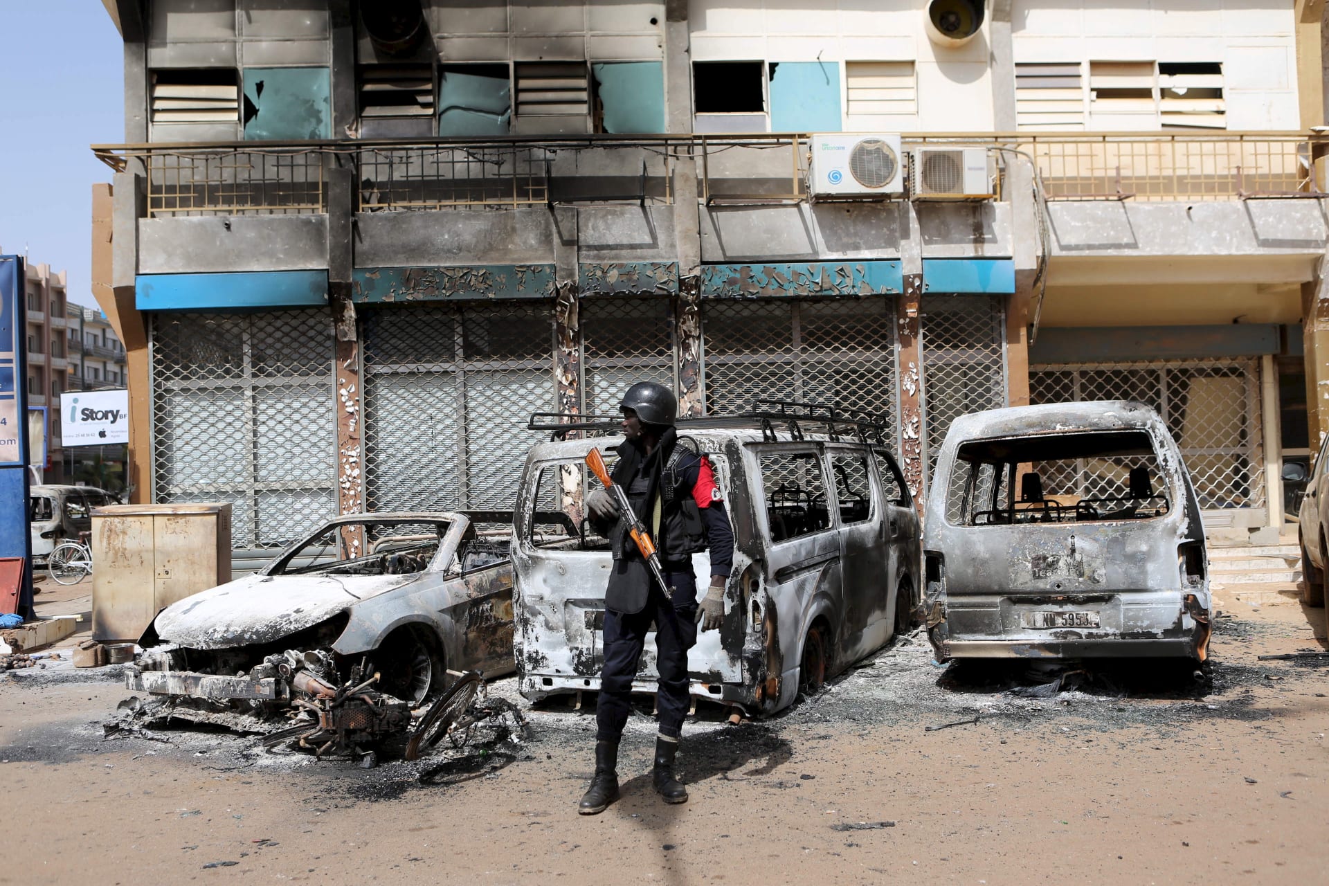 <p>A soldier across the street from Splendid Hotel in Ouagadougou, Burkina Faso, on January 17, 2016, after security forces retook the hotel from al-Qaeda fighters who seized it in an assault that killed two dozen people from eighteen different countries.</p>
