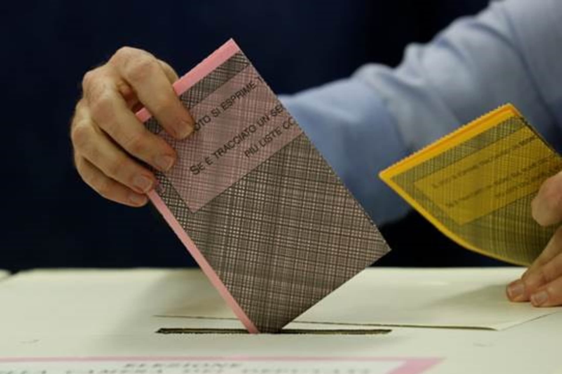 <p>A man casts his vote at a polling station in Milan during Italy’s March 2018 election. </p>
