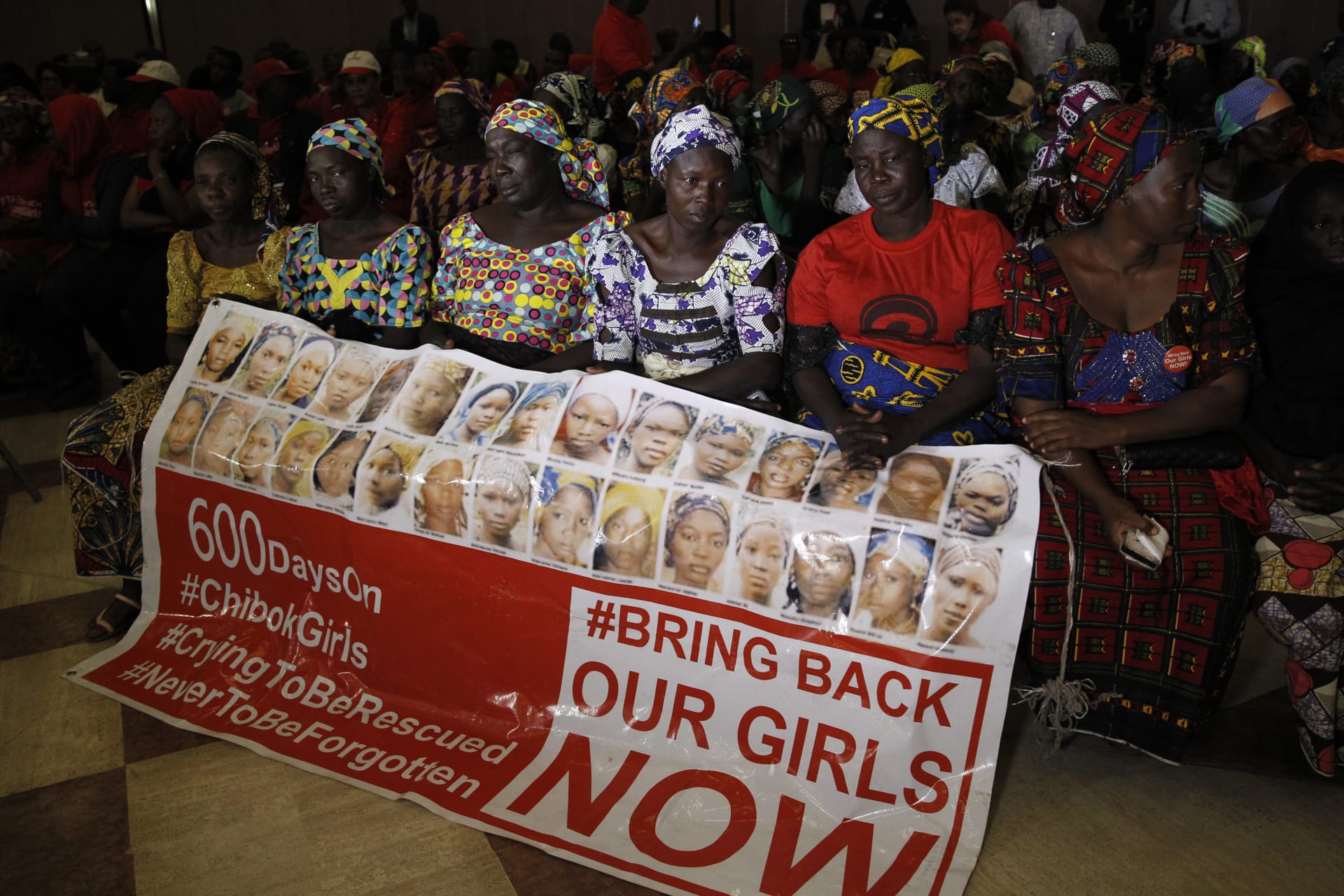 <p>Parents of the Chibok girls hold a “Bring Back Our Girls” banner during their meeting with Nigeria’s President Muhammadu Buhari at the presidential villa in Abuja, Nigeria, on January 14, 2016. The Chibok kidnapping remains the most high profile .</p>