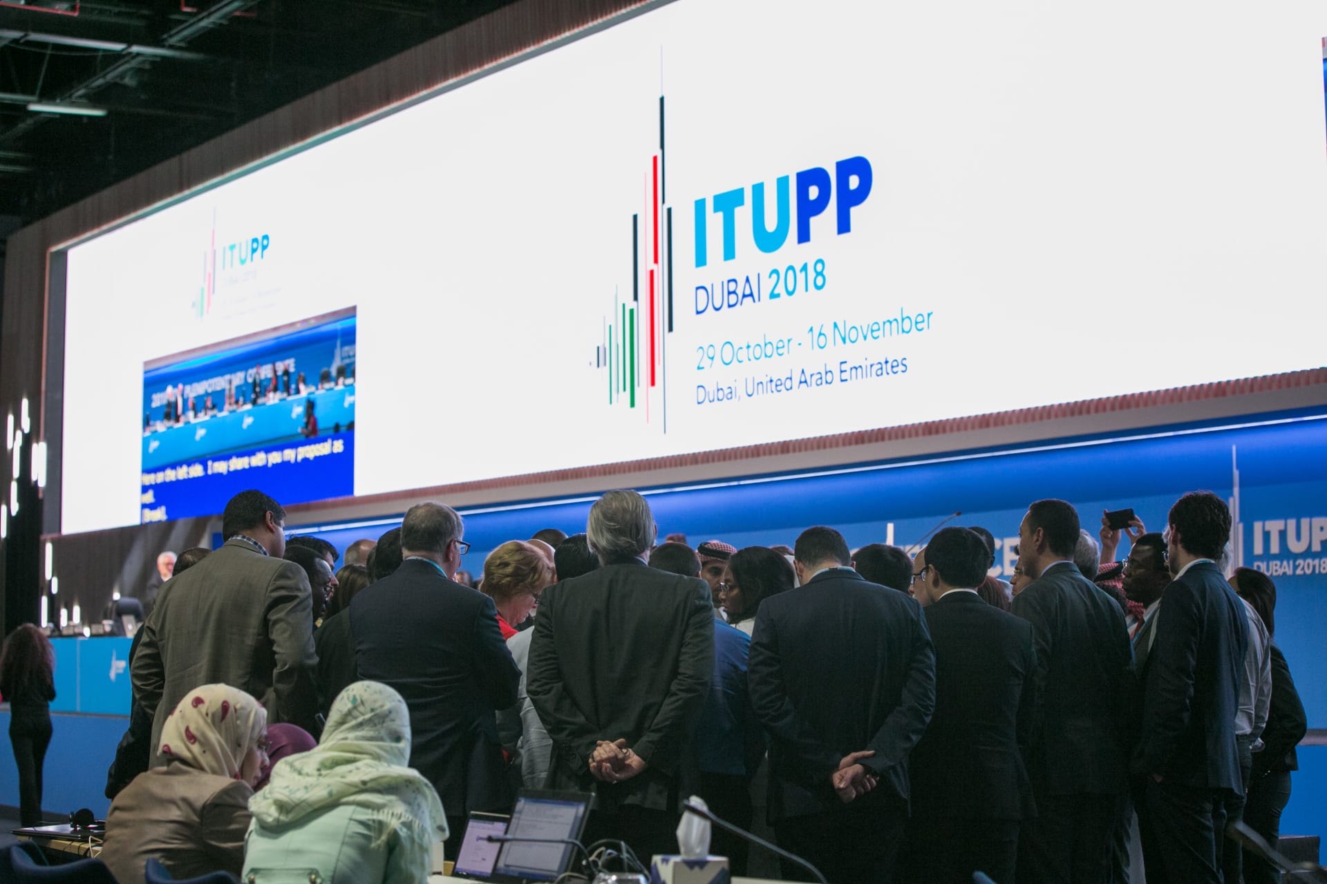 <p>A group huddle to informally negotiate text at the 2018 ITU plenipotentiary conference in Dubai, UAE. </p>