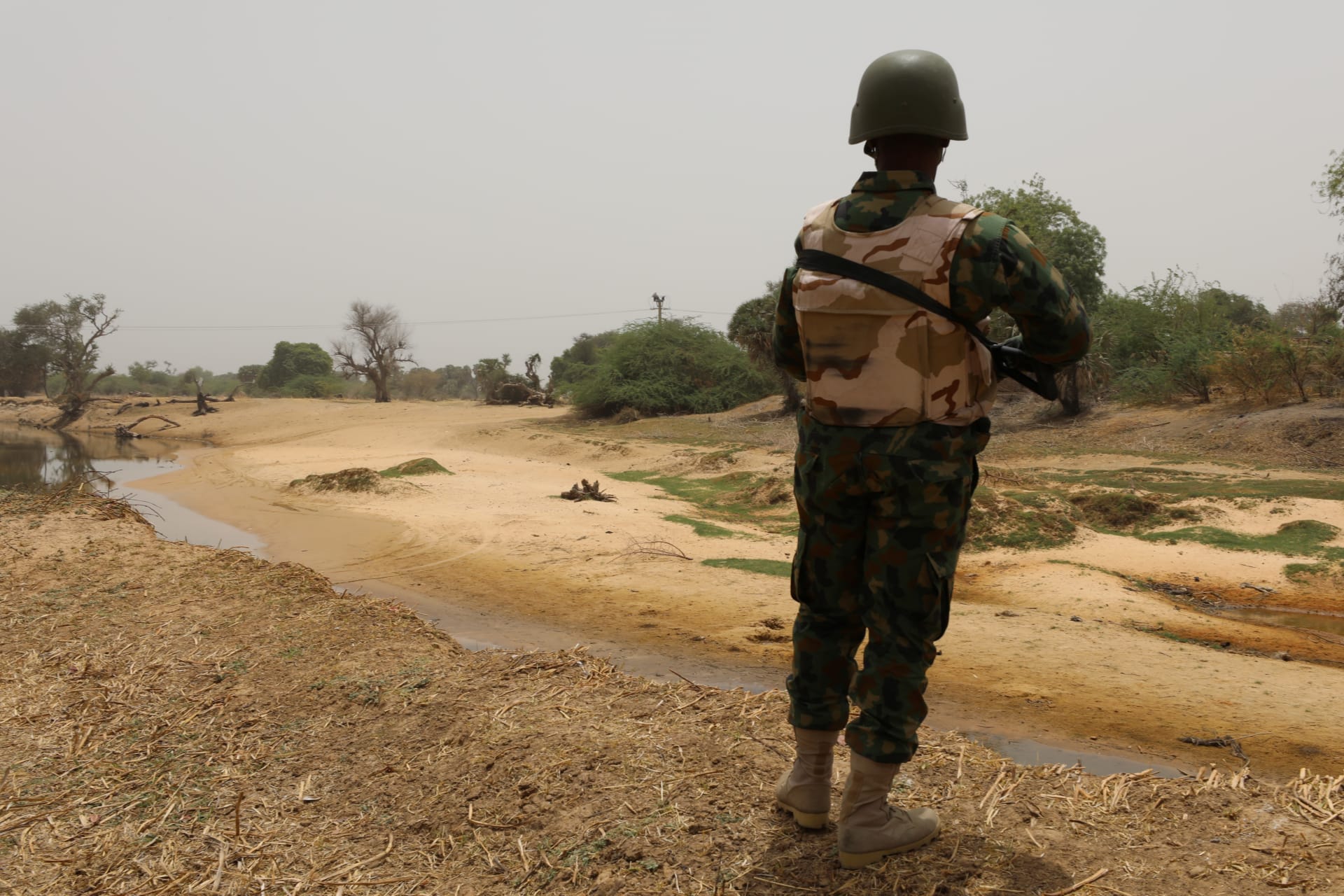 <p>A Nigerian soldier stands watching the border with Niger at Damasak, Borno, Nigeria on April 25, 2017. </p>
