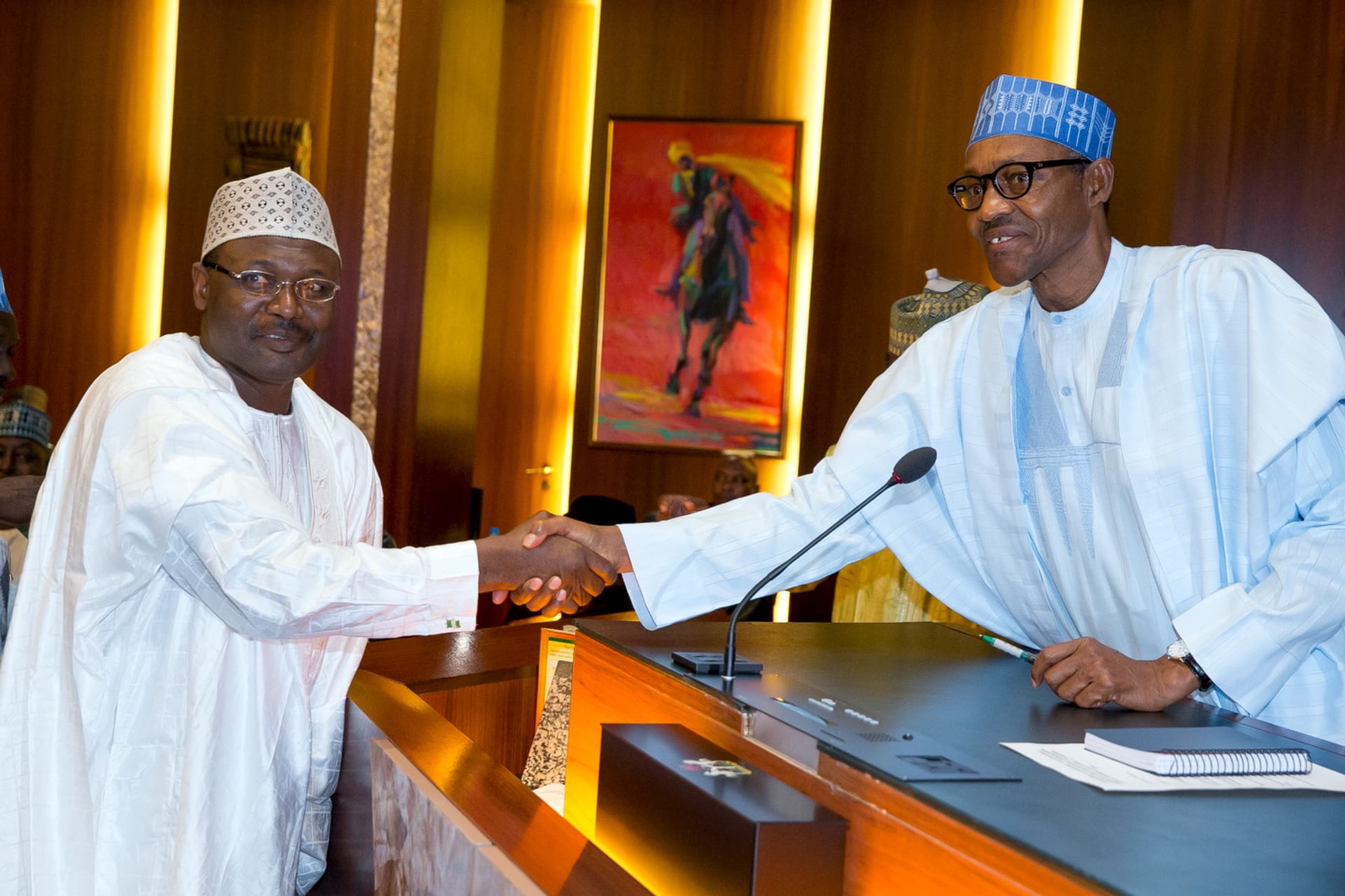 <p>Nigerian President Muhammadu Buhari congratulates new Independent National Electoral Commission (INEC) Chairman Mahmoud Yakubu shortly after his swearing in, in Abuja, Nigeria, on November 9, 2015. </p>
