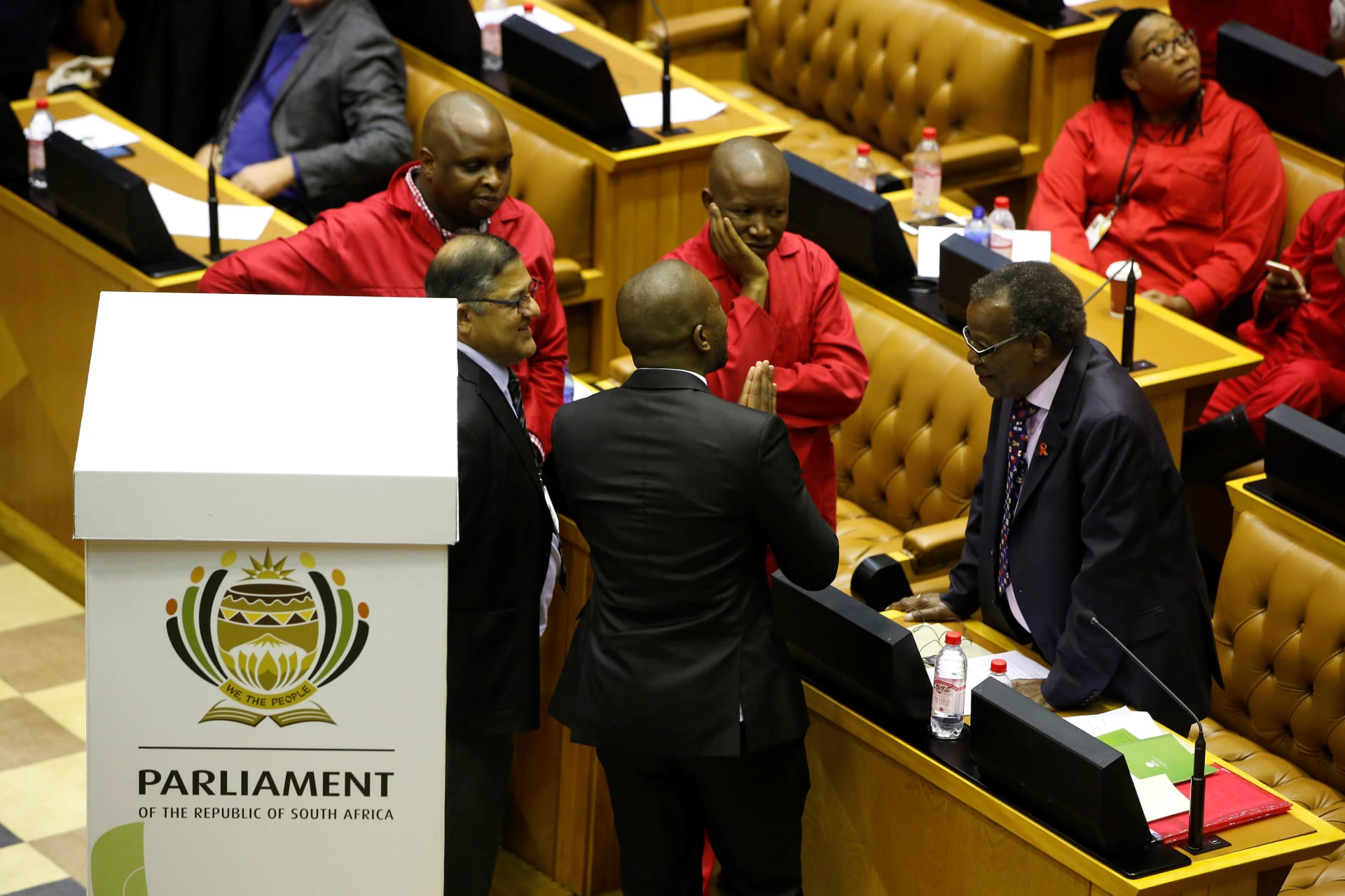<p>Opposition leaders Mmusi Maimane (DA), Julius Malema (EFF) and Mangosuthu Buthelezi (IFP) shortly before voting on the motion of no confidence against South African President Jacob Zuma in parliament in Cape Town, South Africa, on August 8, 2017.</p>
