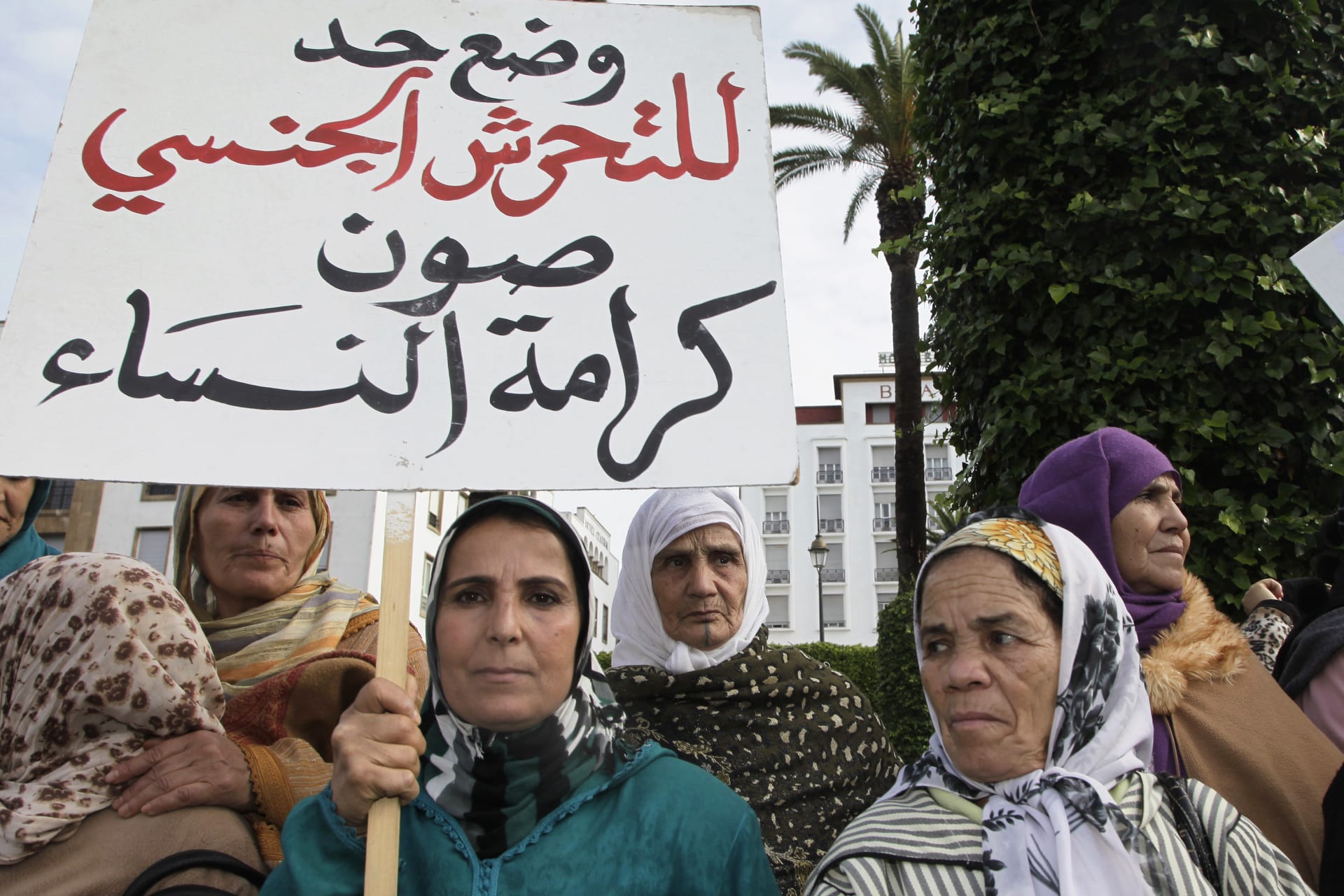 <p>Women from various regions of Morocco protest against violence towards women, in Rabat. The placard reads, “Stopping harassment gives dignity for women.” </p>
