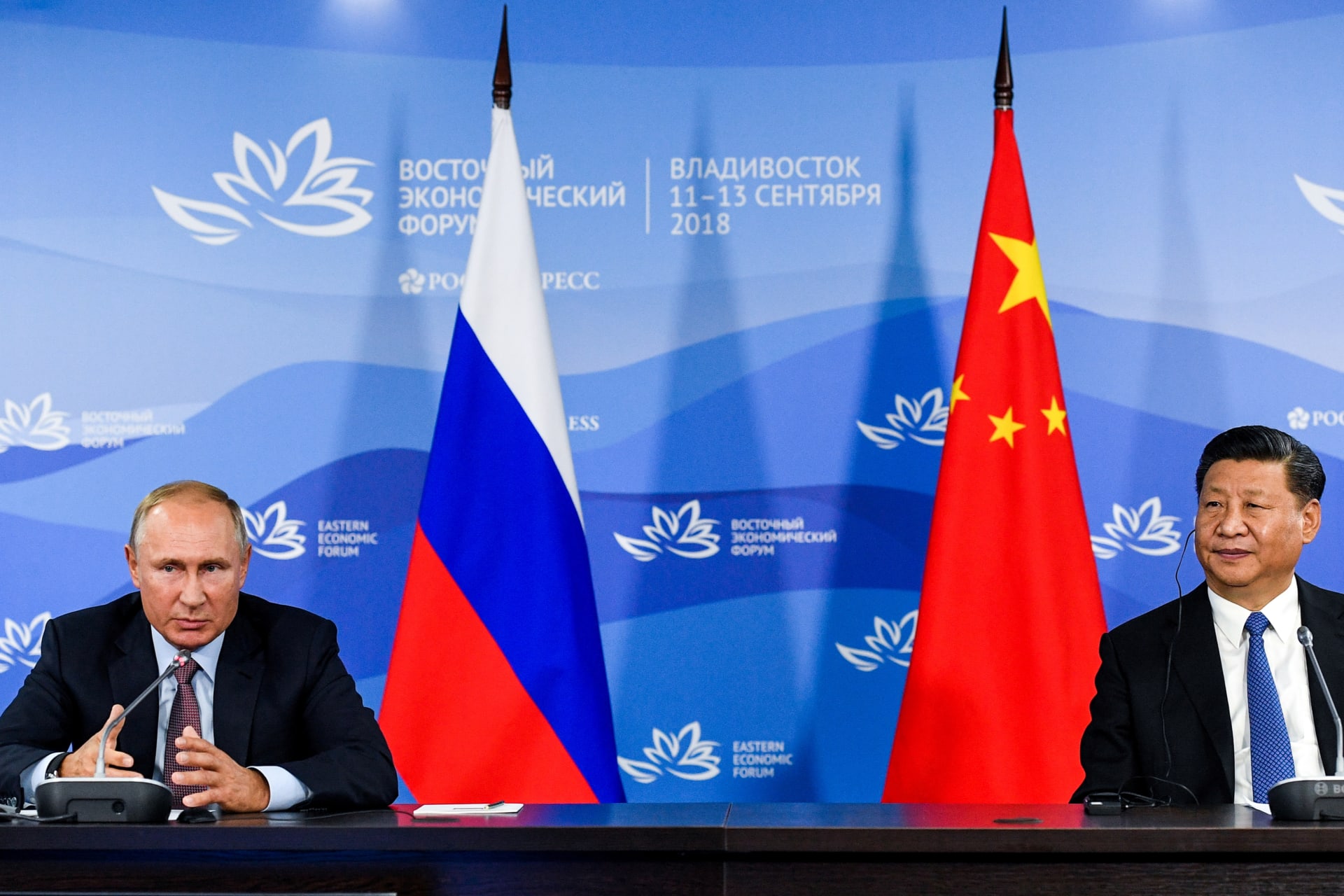 <p>Russian President Vladimir Putin and Chinese President Xi Jinping attend a meeting with participants of a round table discussion on Russia-China Cooperation on the sidelines of the Eastern Economic Forum in Vladivostok, Russia September 11, 2018</p>
