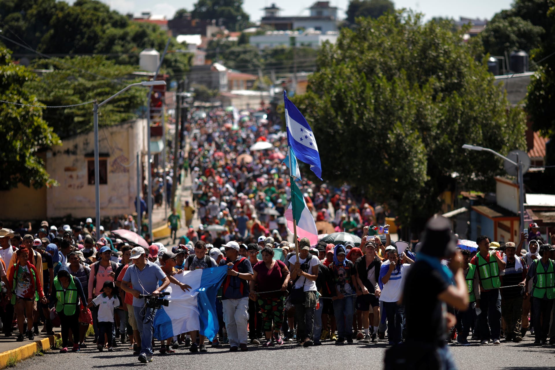 <p>Central American migrants walk along a street, as they continue their journey trying to reach the U.S., in Tapachula, Mexico October 22, 2018. </p>
