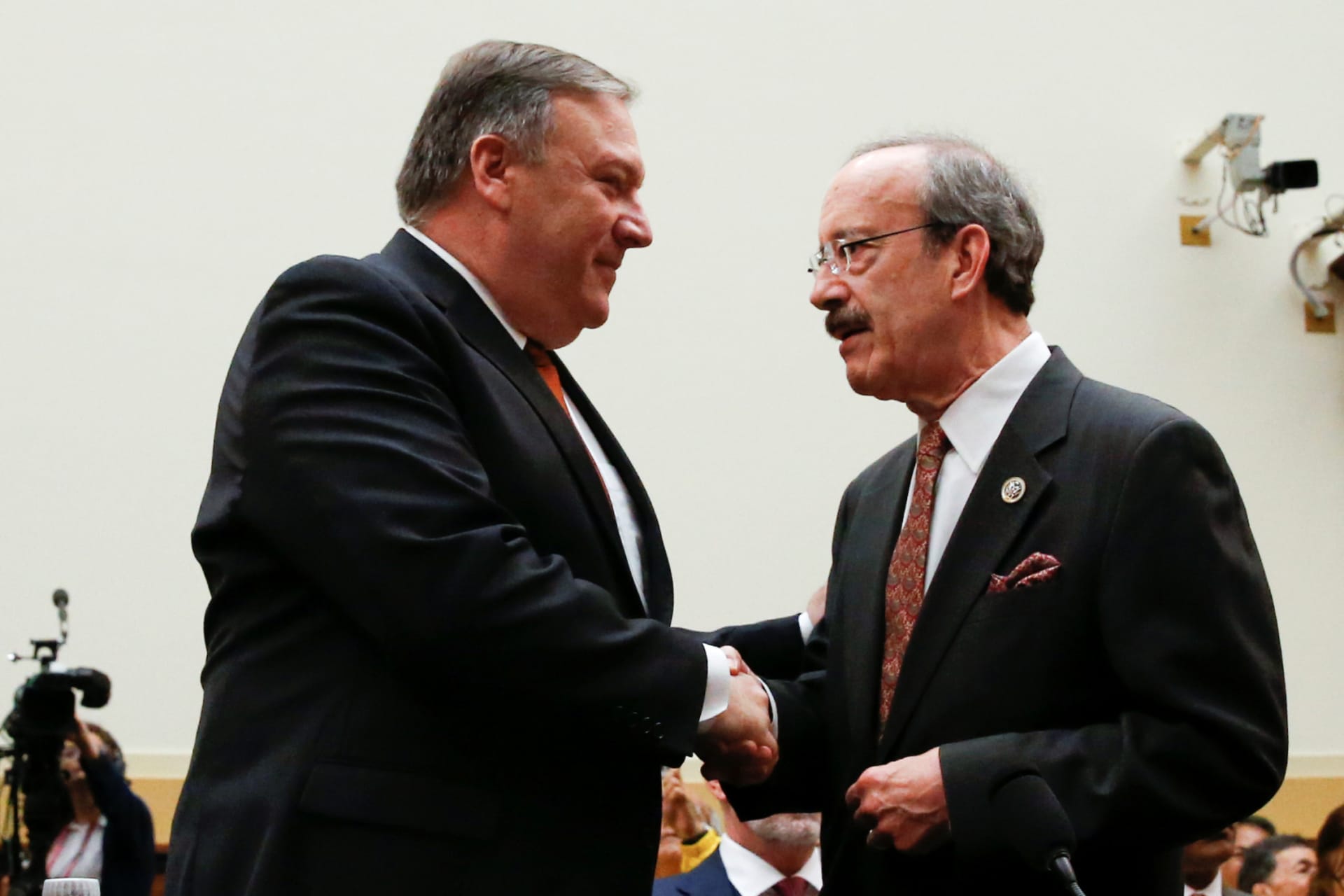 <p>U.S. Secretary of State Mike Pompeo shakes hands with House Foreign Relations Committee Democratic Ranking member Rep. Eliot Engel (D-NY) before a hearing of the U.S. House Foreign Affairs Committee on Capitol Hill in Washington, DC on May 23, 2018.</p>

