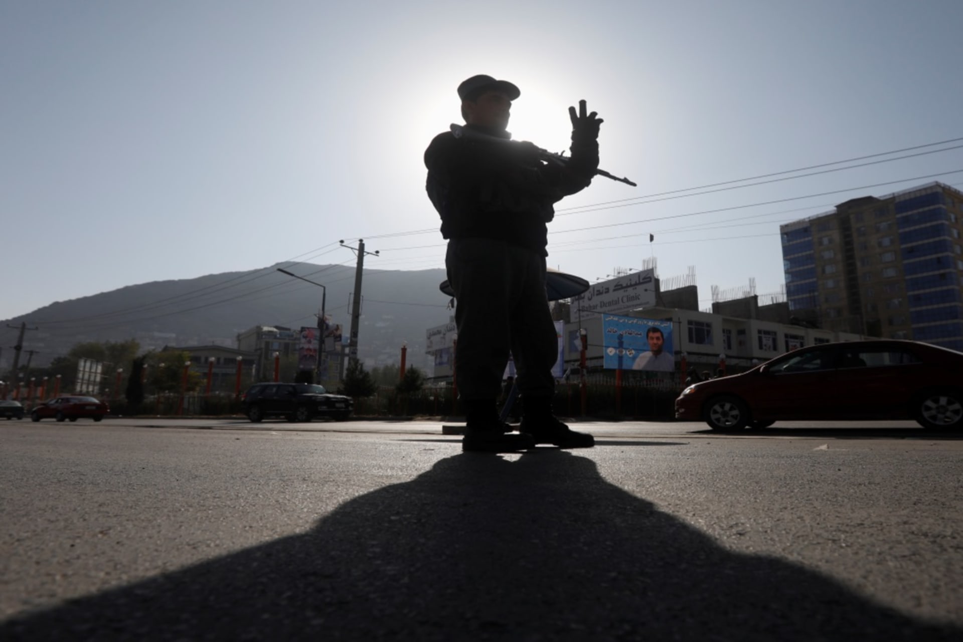 <p>An Afghan policeman stands guard at a checkpoint in Kabul, Afghanistan, on October 19, 2018, a day before parliamentary elections.</p>

