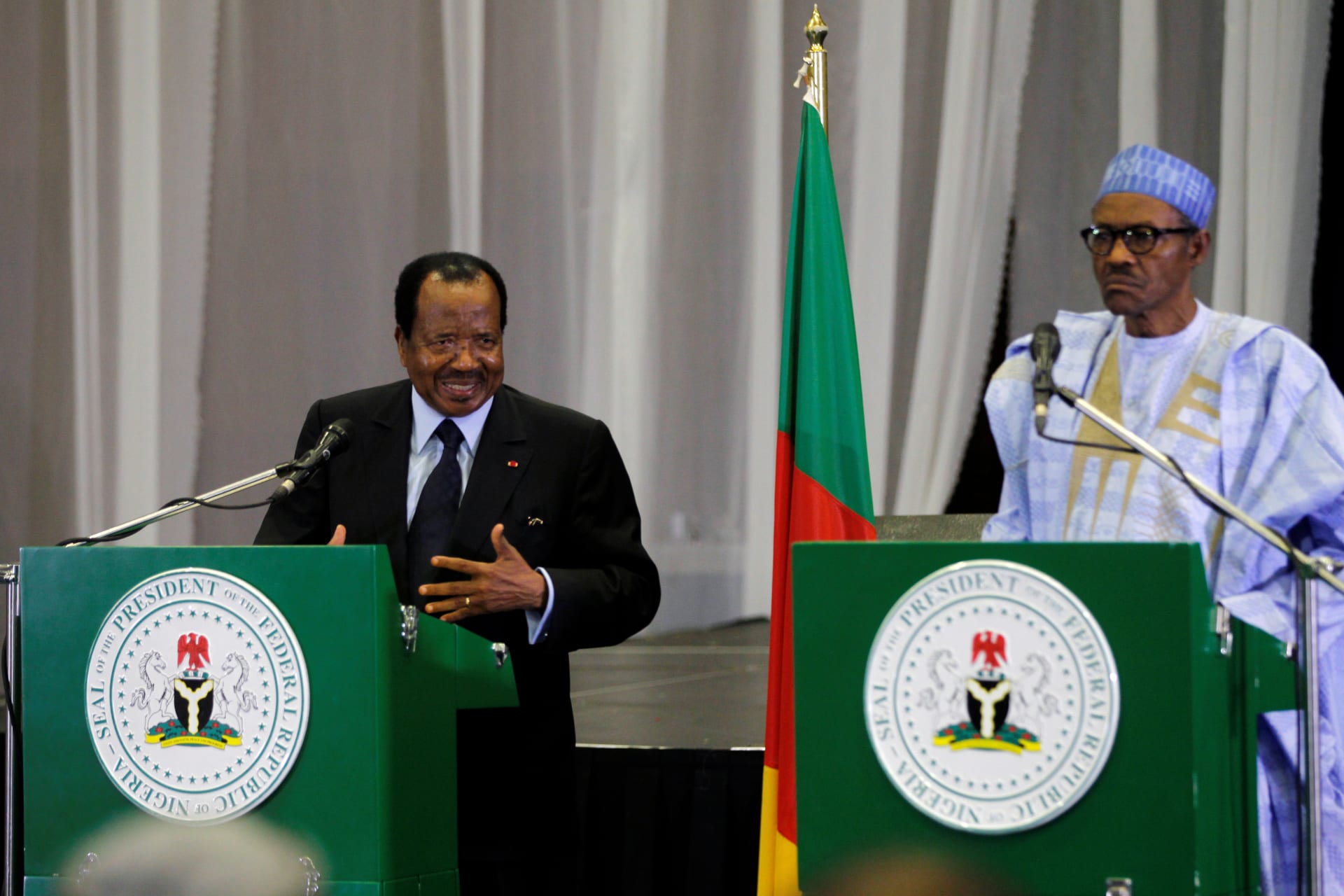 <p>Cameroon’s President Paul Biya (L) speaks during a joint news conference with Nigeria’s President Muhammadu Buhari in Abuja, Nigeria, on May 4, 2016.</p>
