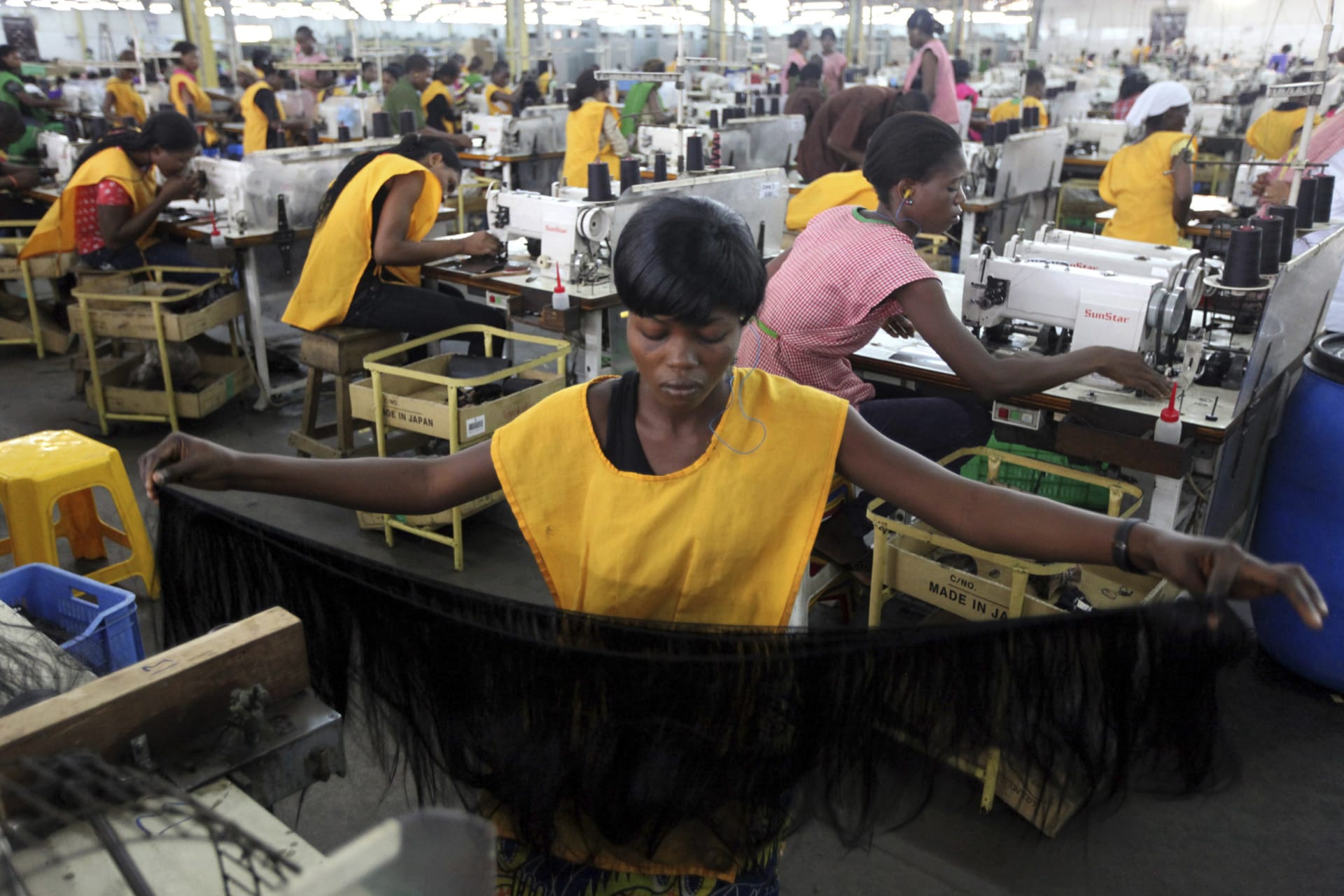 <p>Women work in a fiber hair factory in Ikeja district in Lagos, Nigeria. December 1, 2011.</p>
