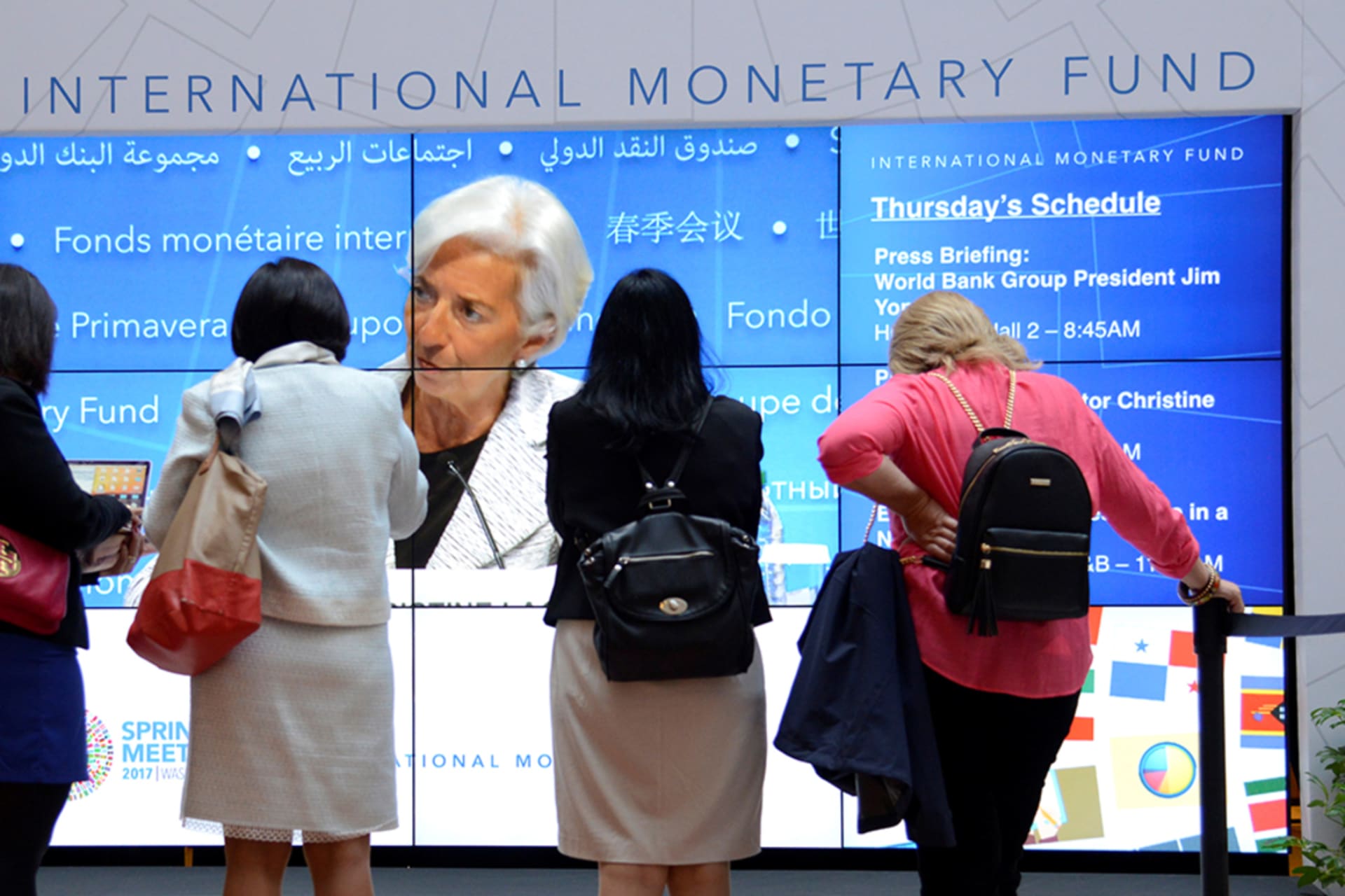 <p>Visitors watch IMF Managing Director Christine Lagarde during the opening of the IMF and World Bank Annual Spring Meetings in Washington, DC, in 2017.</p>
