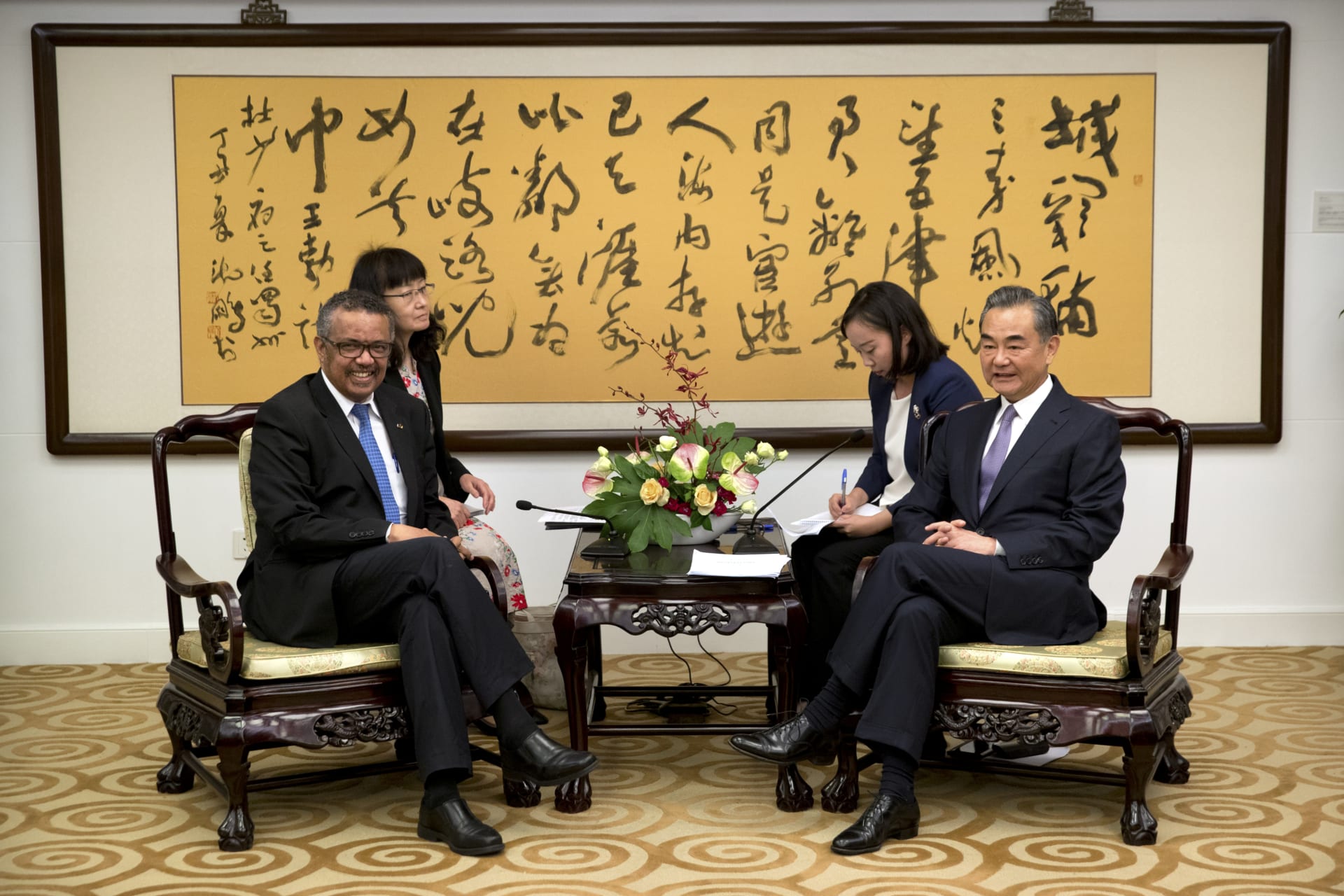 <p>Tedros Adhanom Ghebreyesus, left, Director General of the World Health Organization, and Chinese Foreign Minister Wang Yi, right, before the start of a meeting at the Ministry of Foreign Affairs in Beijing on July 17, 2018. </p>
